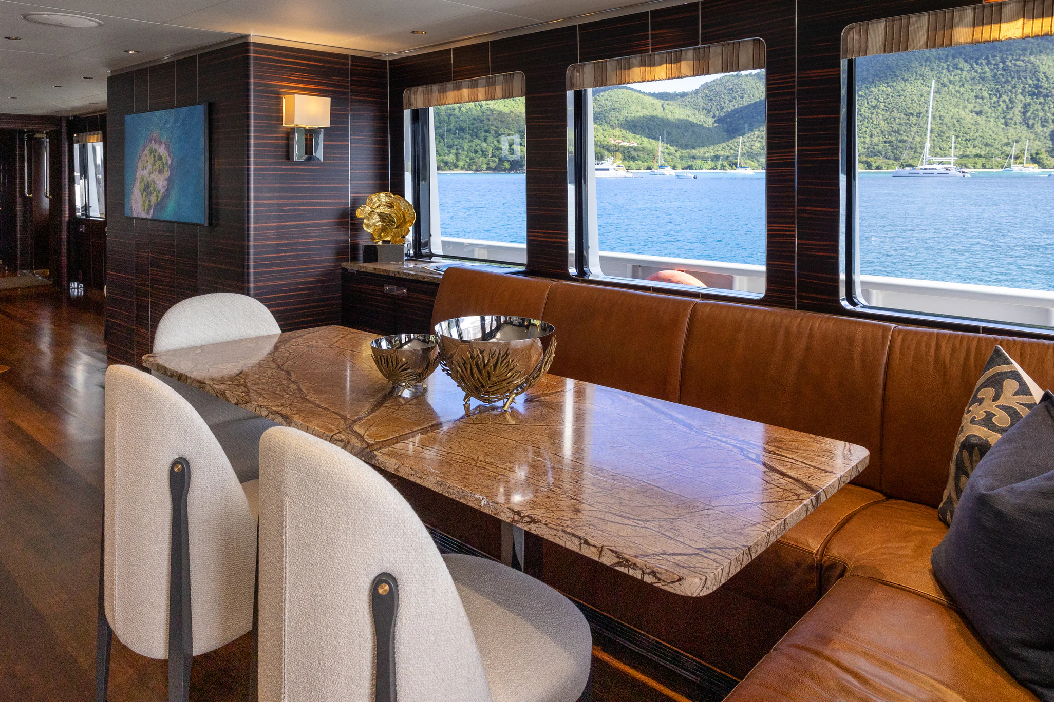 a dining room with a table and chairs aboard AVALON Yacht for Charter