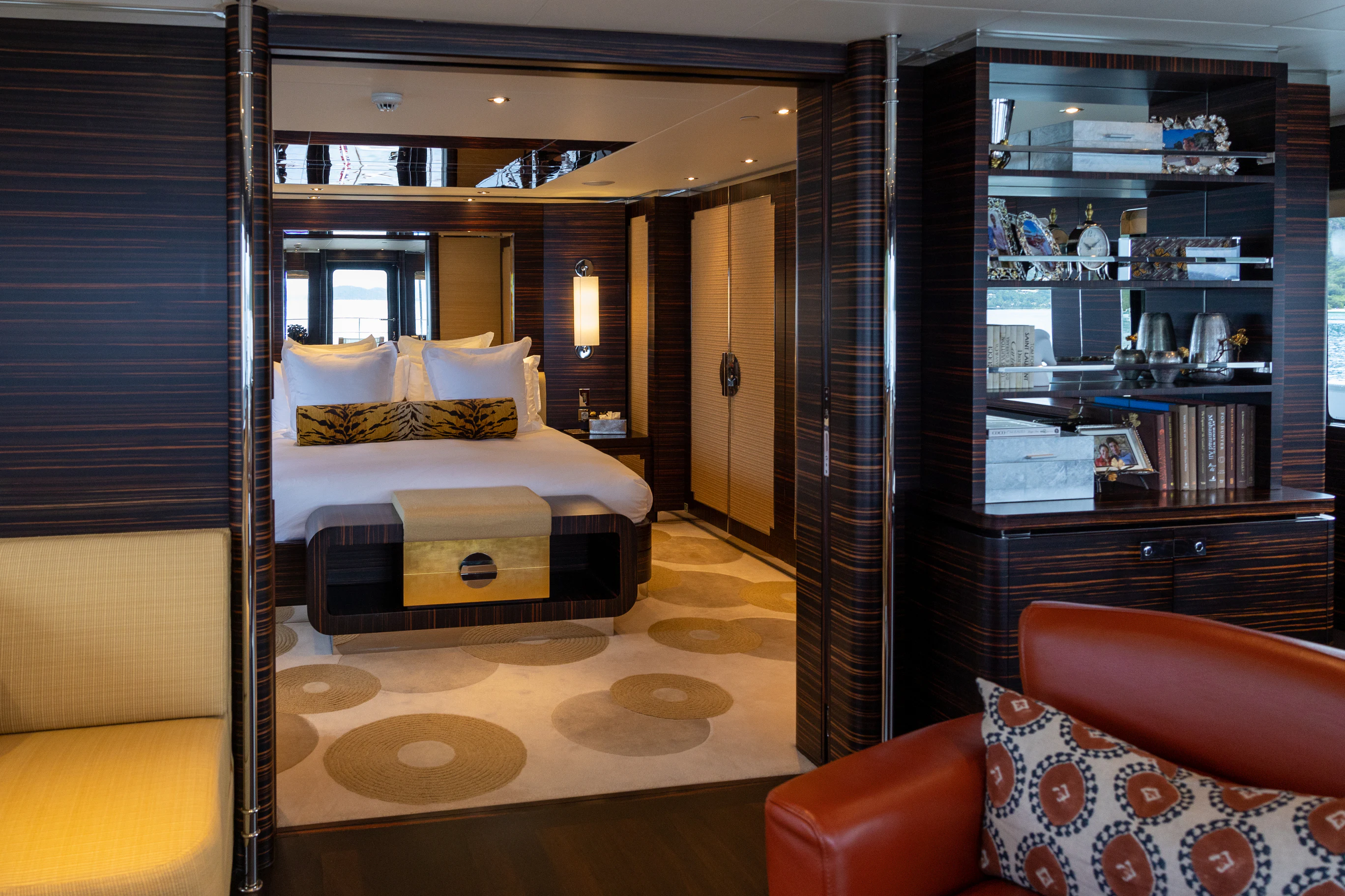 a room with a bed and a mirror aboard AVALON Yacht for Charter