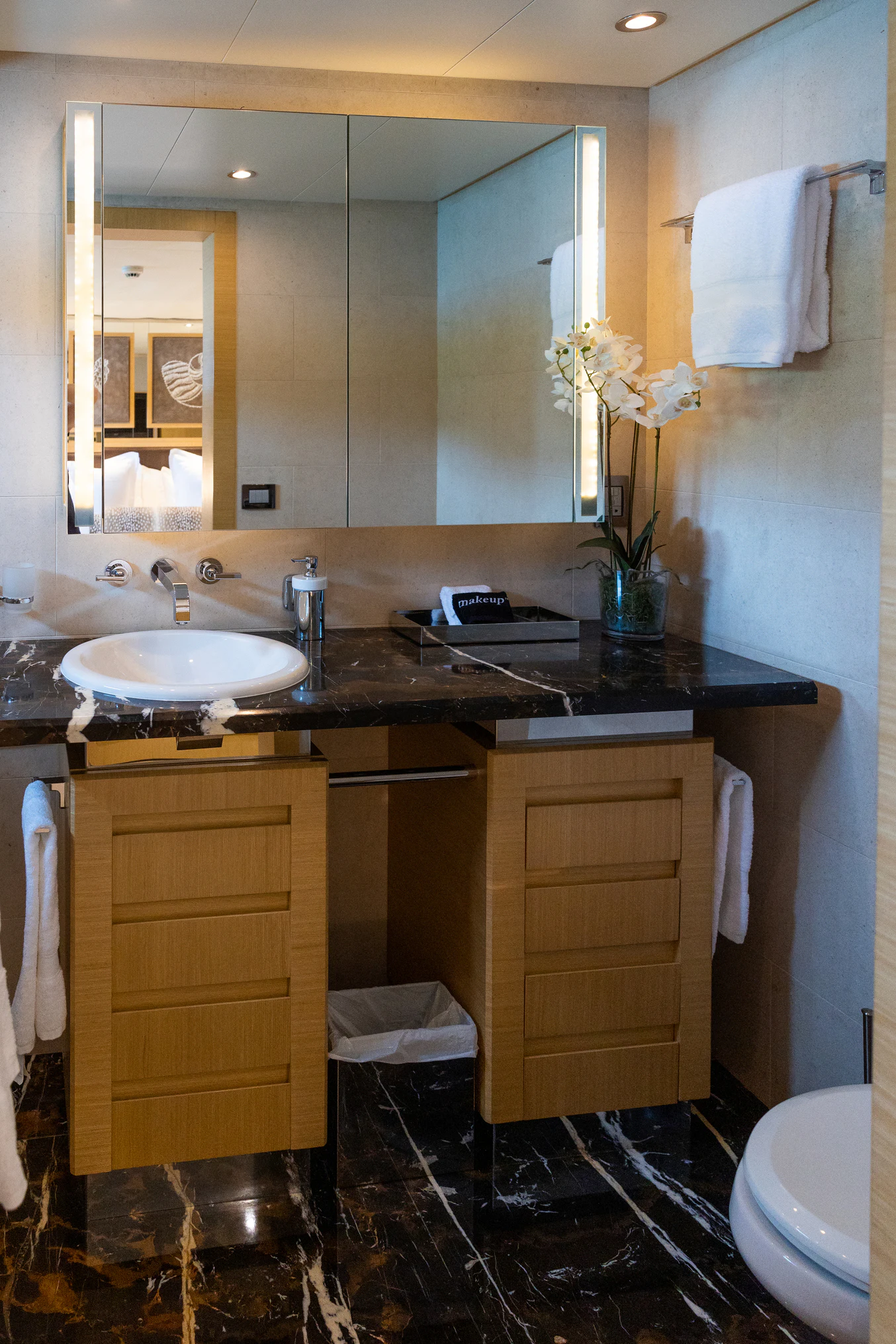 a bathroom with a sink and a mirror aboard AVALON Yacht for Charter