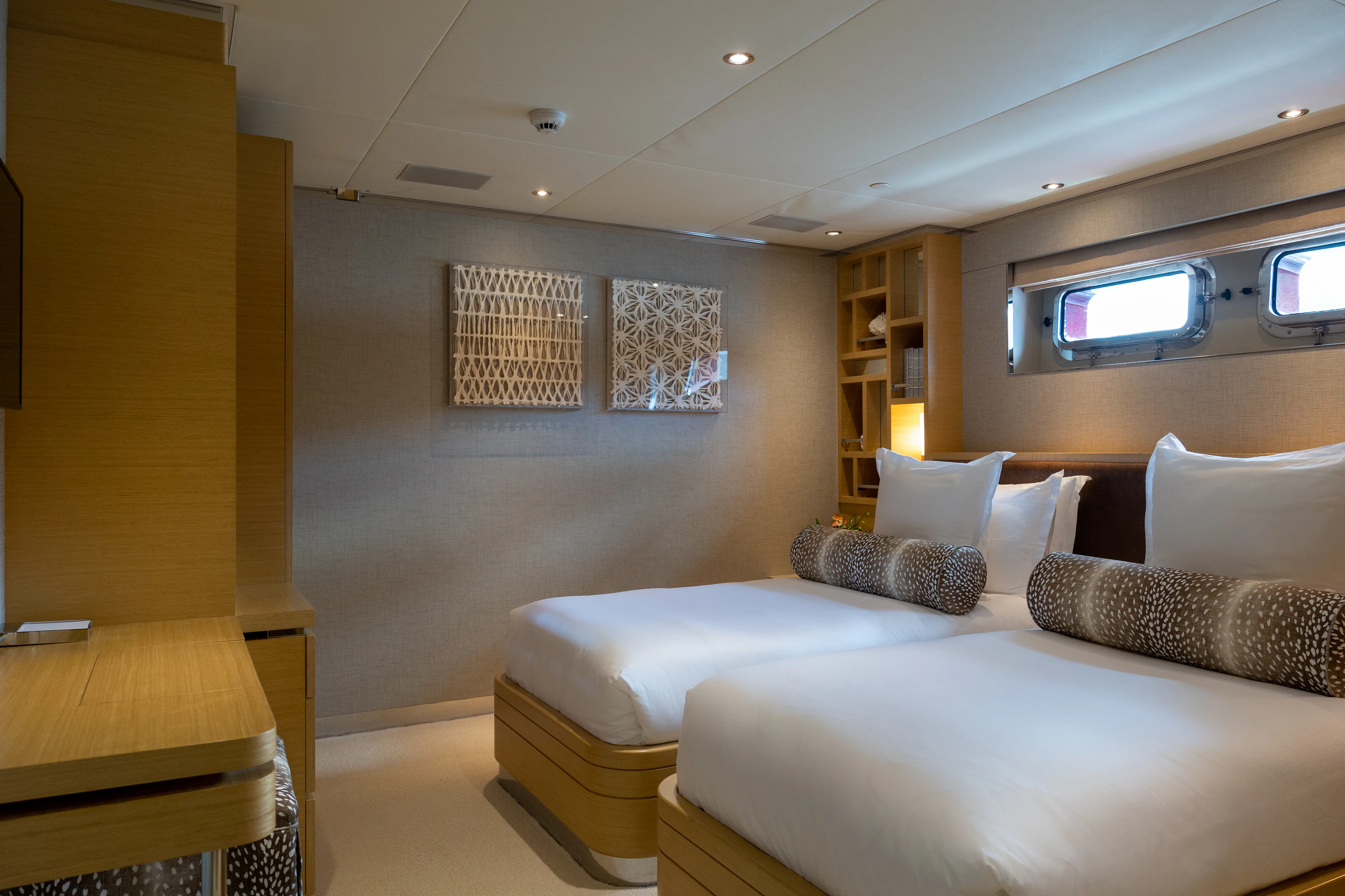 a room with a bed and a tv on the wall aboard AVALON Yacht for Charter