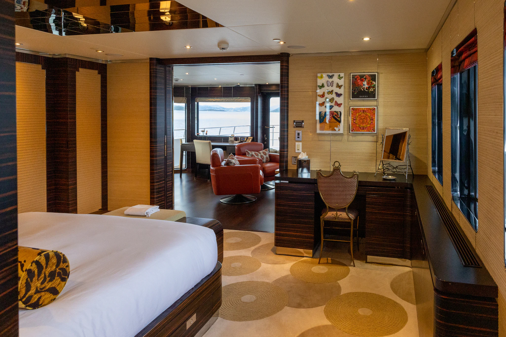a bedroom with a bed and a desk aboard AVALON Yacht for Charter