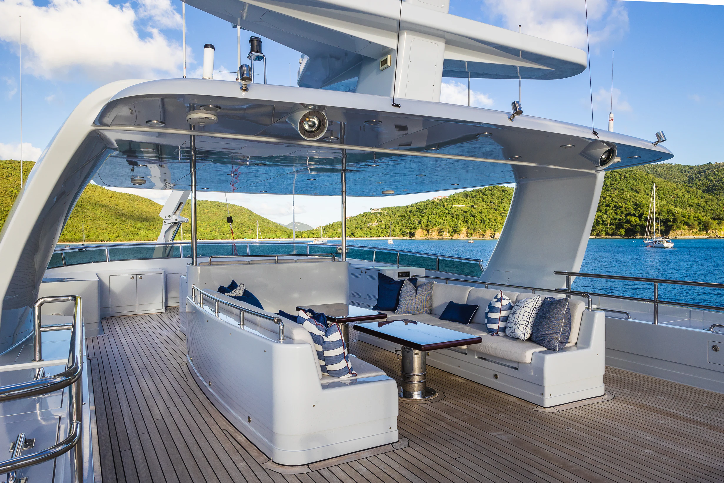a large white bathtub on a deck with a large white swimming pool aboard AVALON Yacht for Charter
