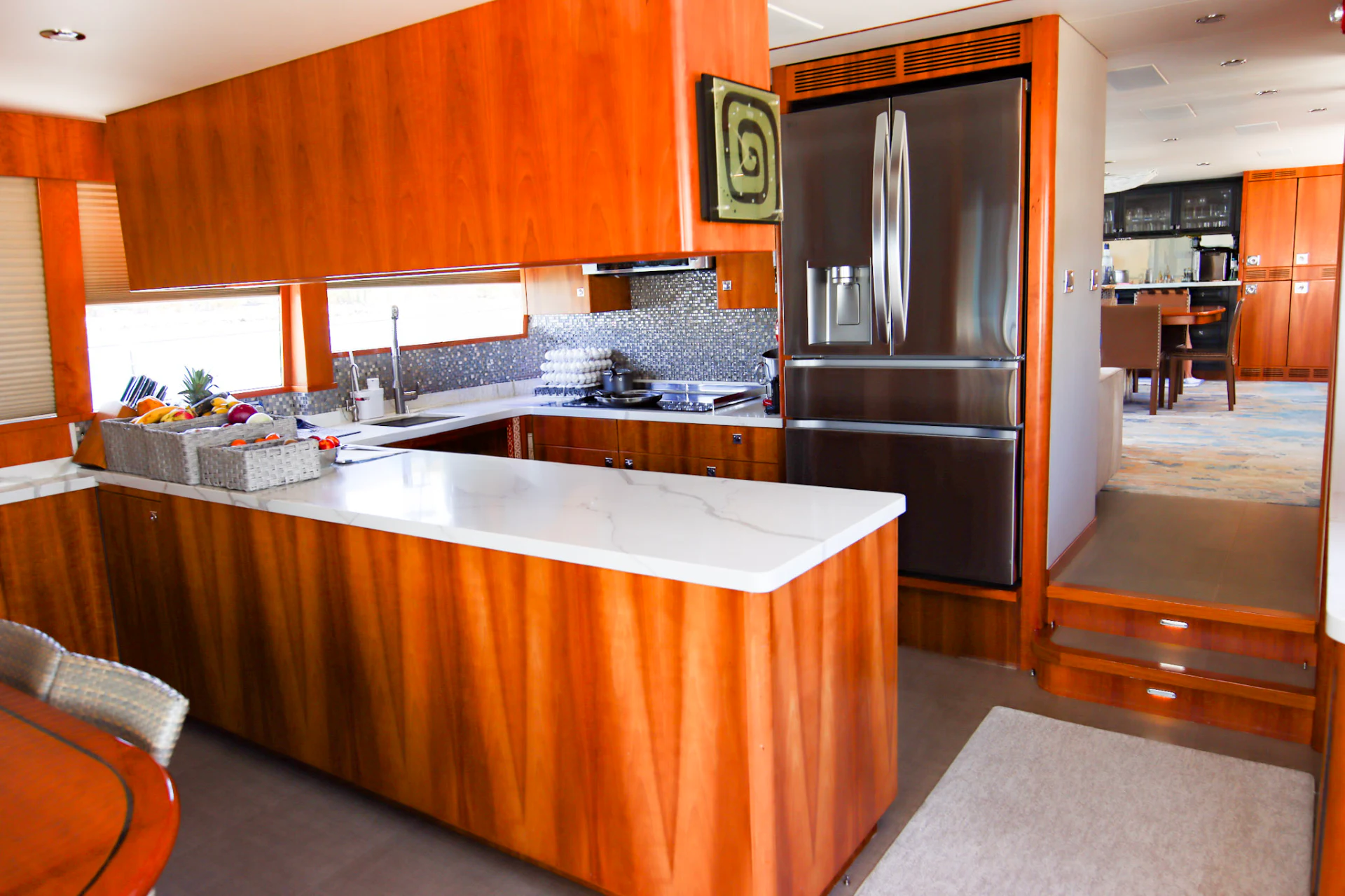 a kitchen with a stainless steel refrigerator aboard MARDIOSA Yacht for Sale
