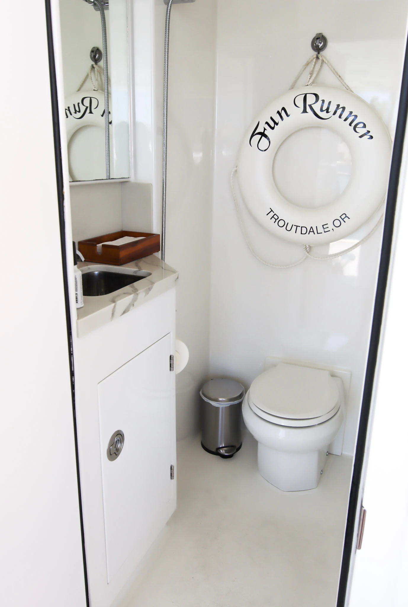 a toilet with a sign on the wall aboard MARDIOSA Yacht for Sale