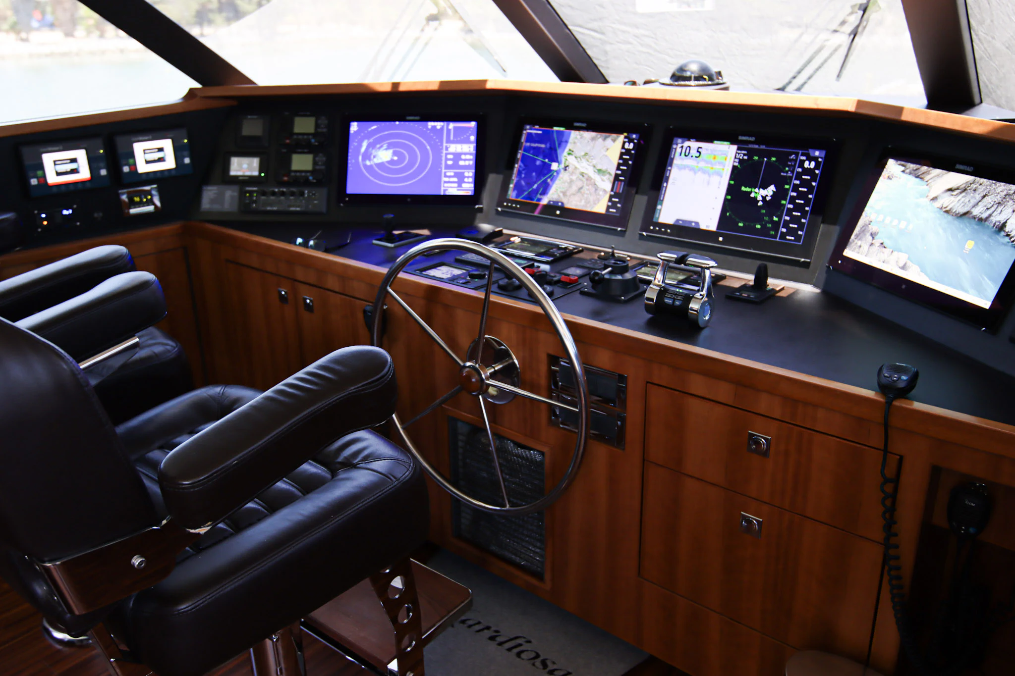 a room with many monitors and keyboards aboard MARDIOSA Yacht for Sale