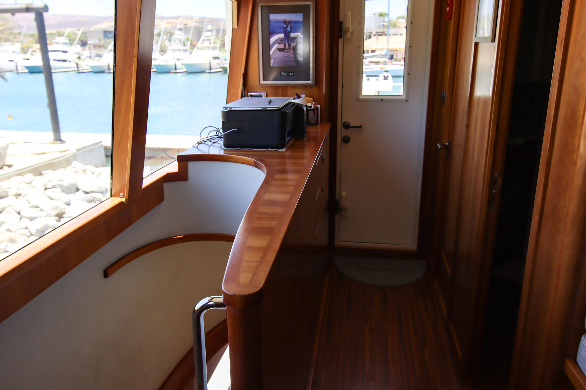 a room with a table and a window aboard MARDIOSA Yacht for Sale