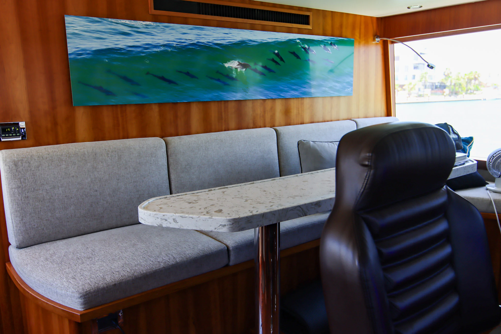 a couch and a table in a room aboard MARDIOSA Yacht for Sale