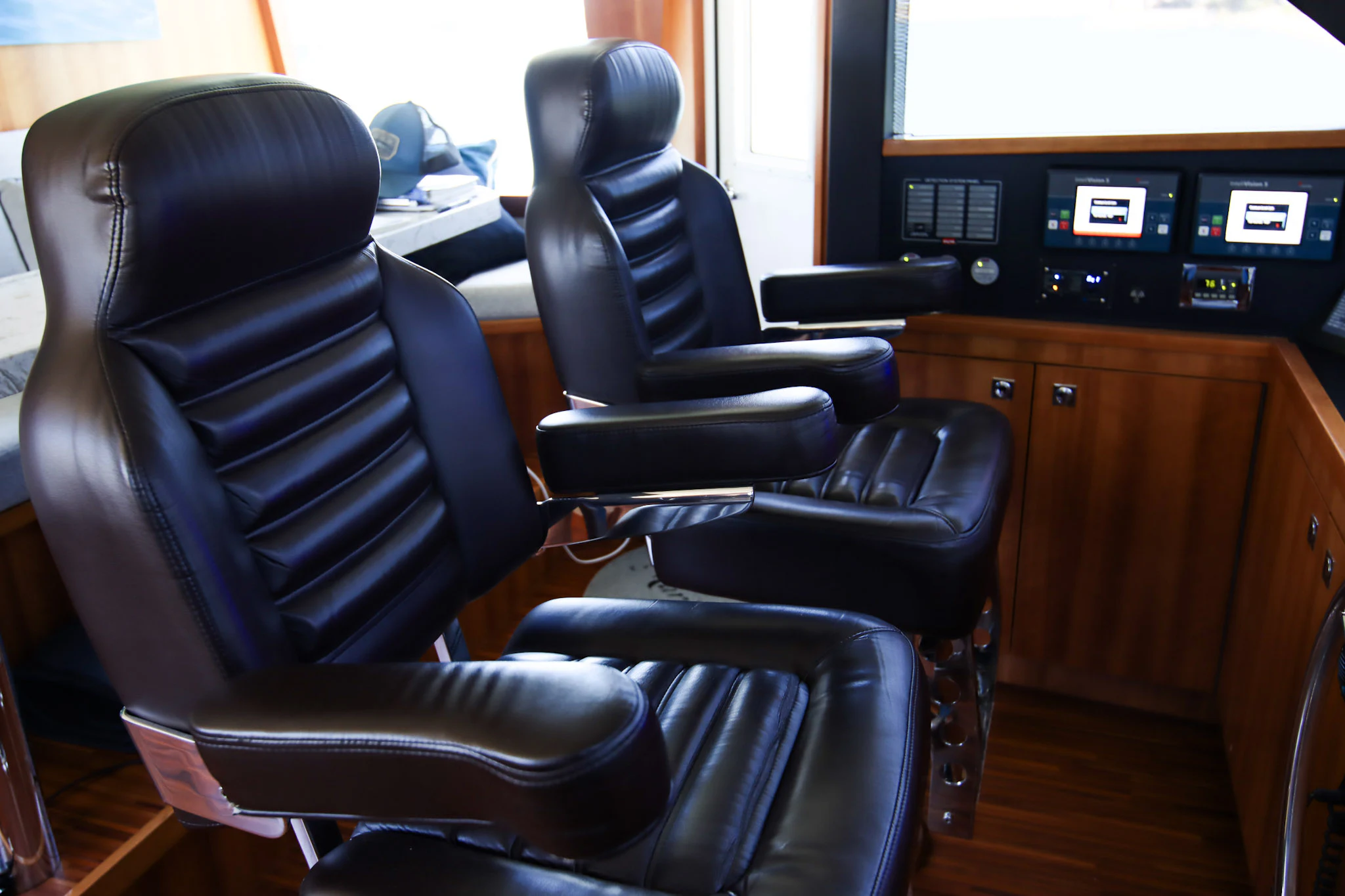 a room with chairs and desks aboard MARDIOSA Yacht for Sale