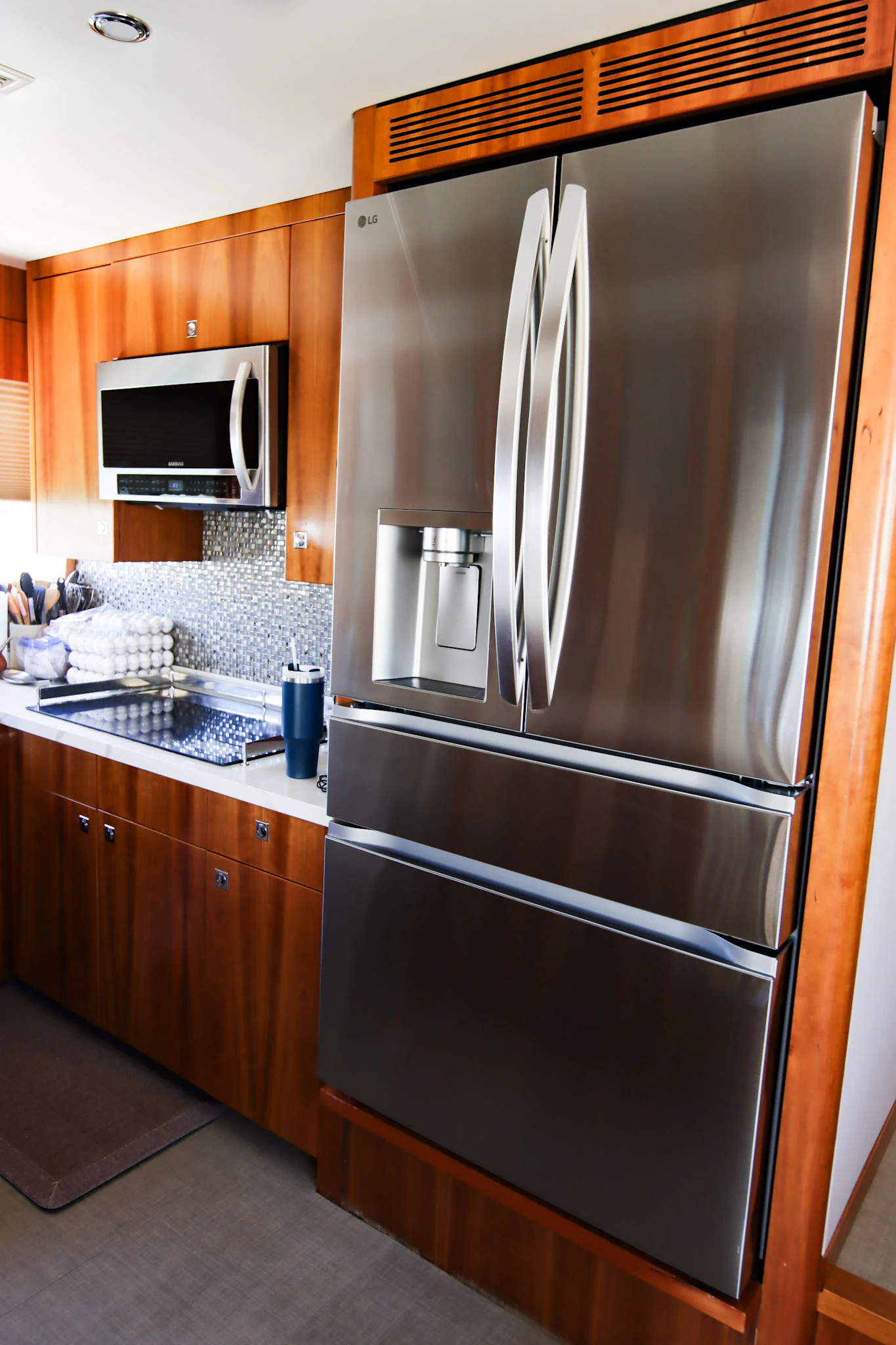 a stainless steel refrigerator in a kitchen aboard MARDIOSA Yacht for Sale