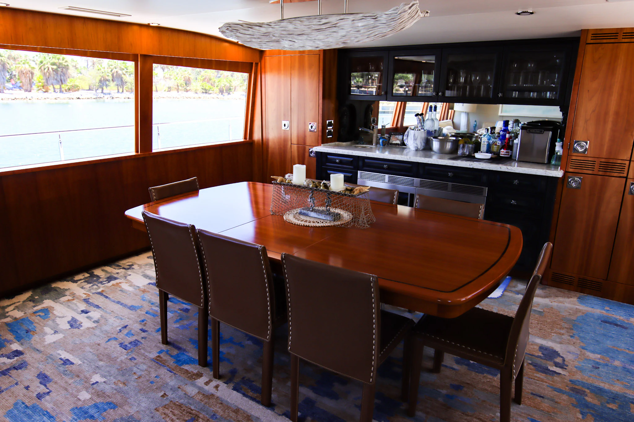a kitchen with a dining table aboard MARDIOSA Yacht for Sale