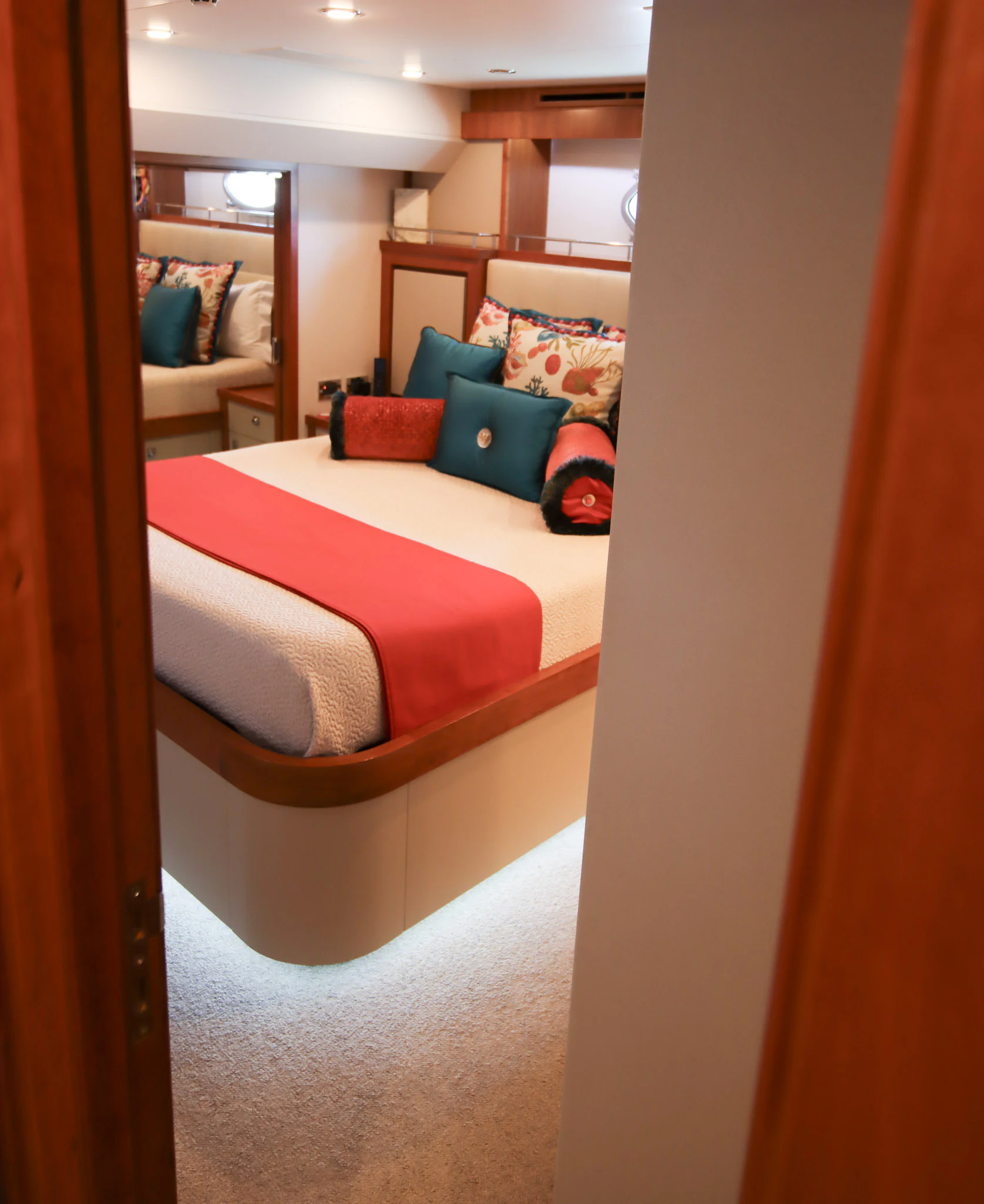 a bedroom with a bed and a chair aboard MARDIOSA Yacht for Sale