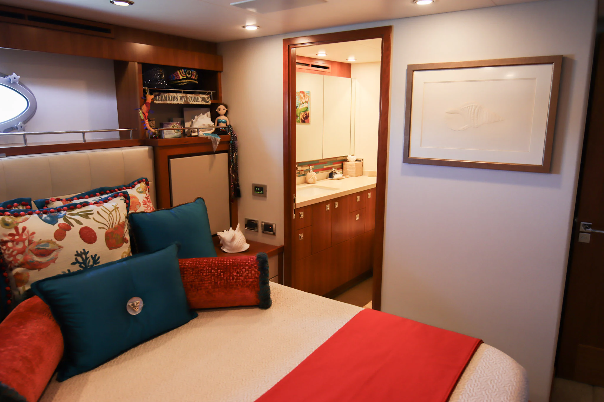 a bedroom with a bed and a red table aboard MARDIOSA Yacht for Sale