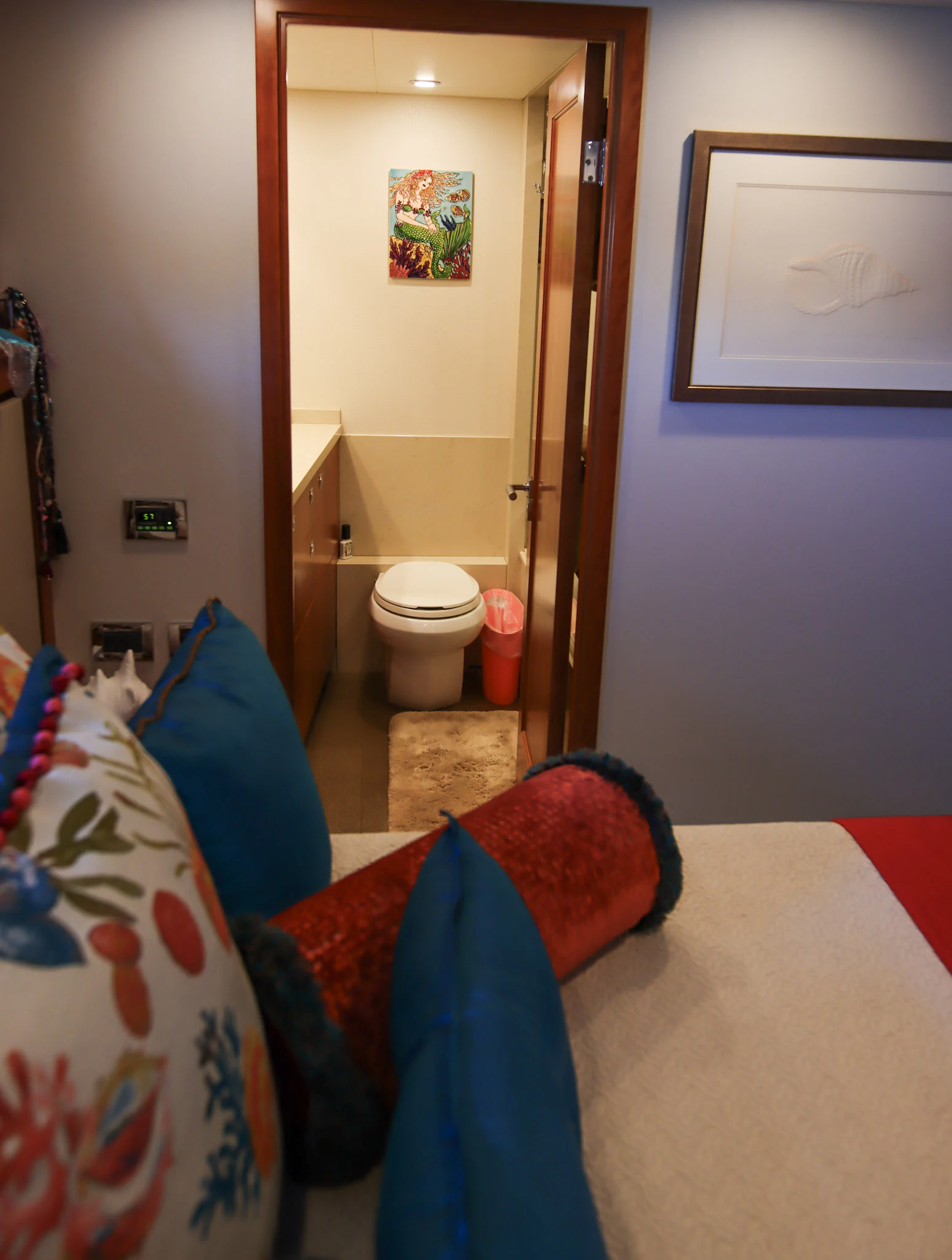 a bathroom with a toilet and a rug aboard MARDIOSA Yacht for Sale
