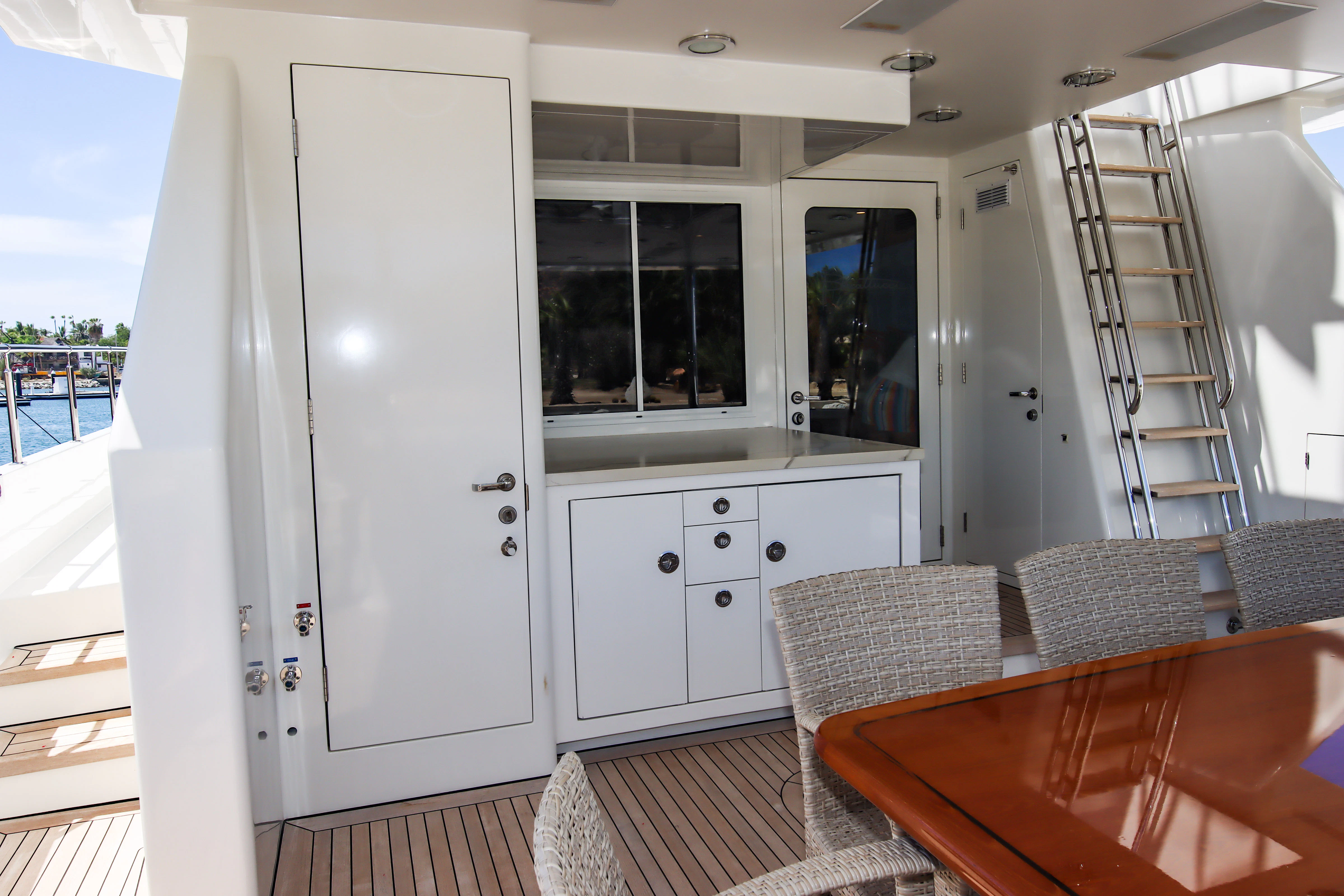 a room with a table and chairs aboard MARDIOSA Yacht for Sale