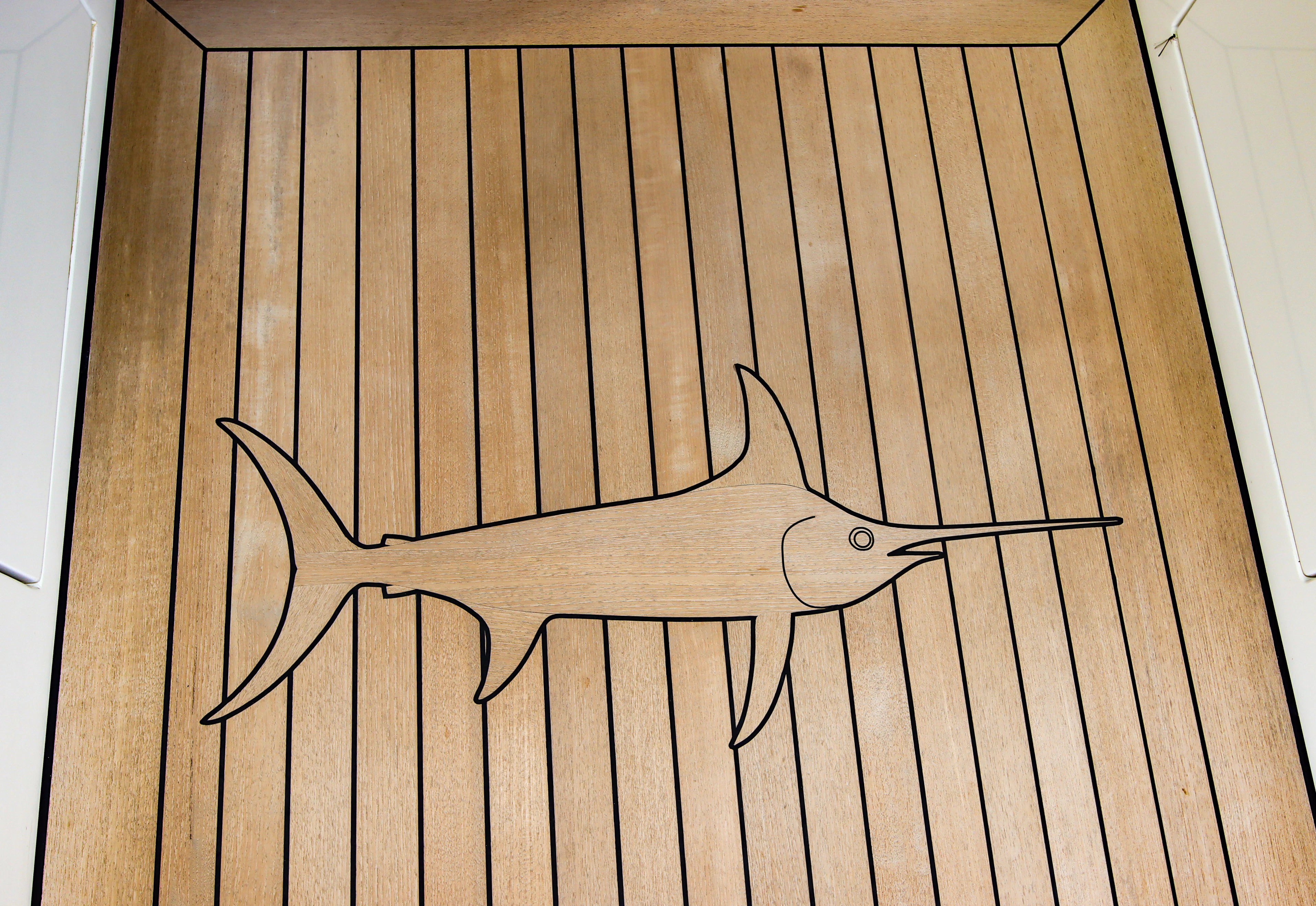 a wood floor with a drawing of a spider on it aboard MARDIOSA Yacht for Sale