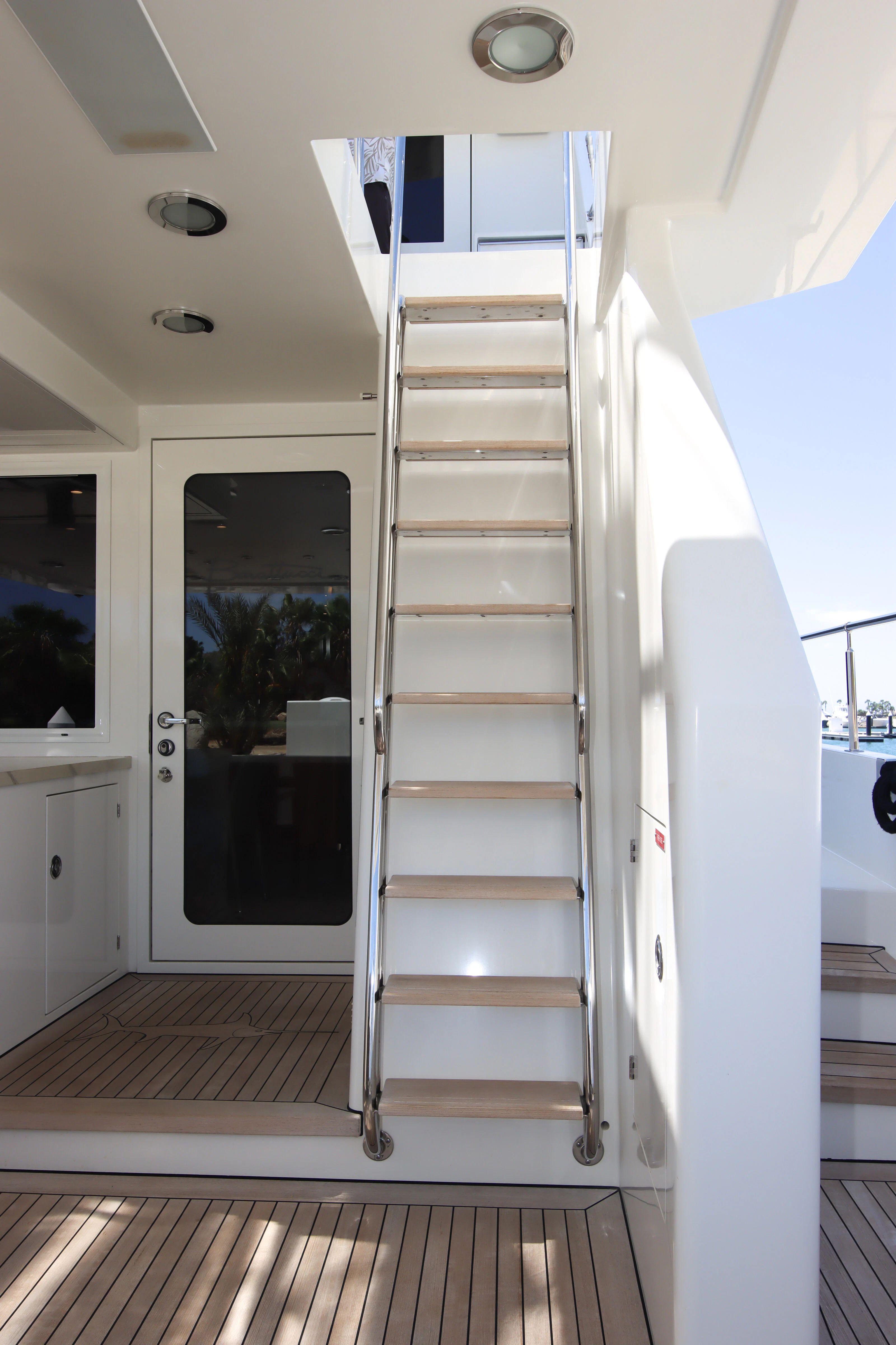 a white door with glass doors aboard MARDIOSA Yacht for Sale