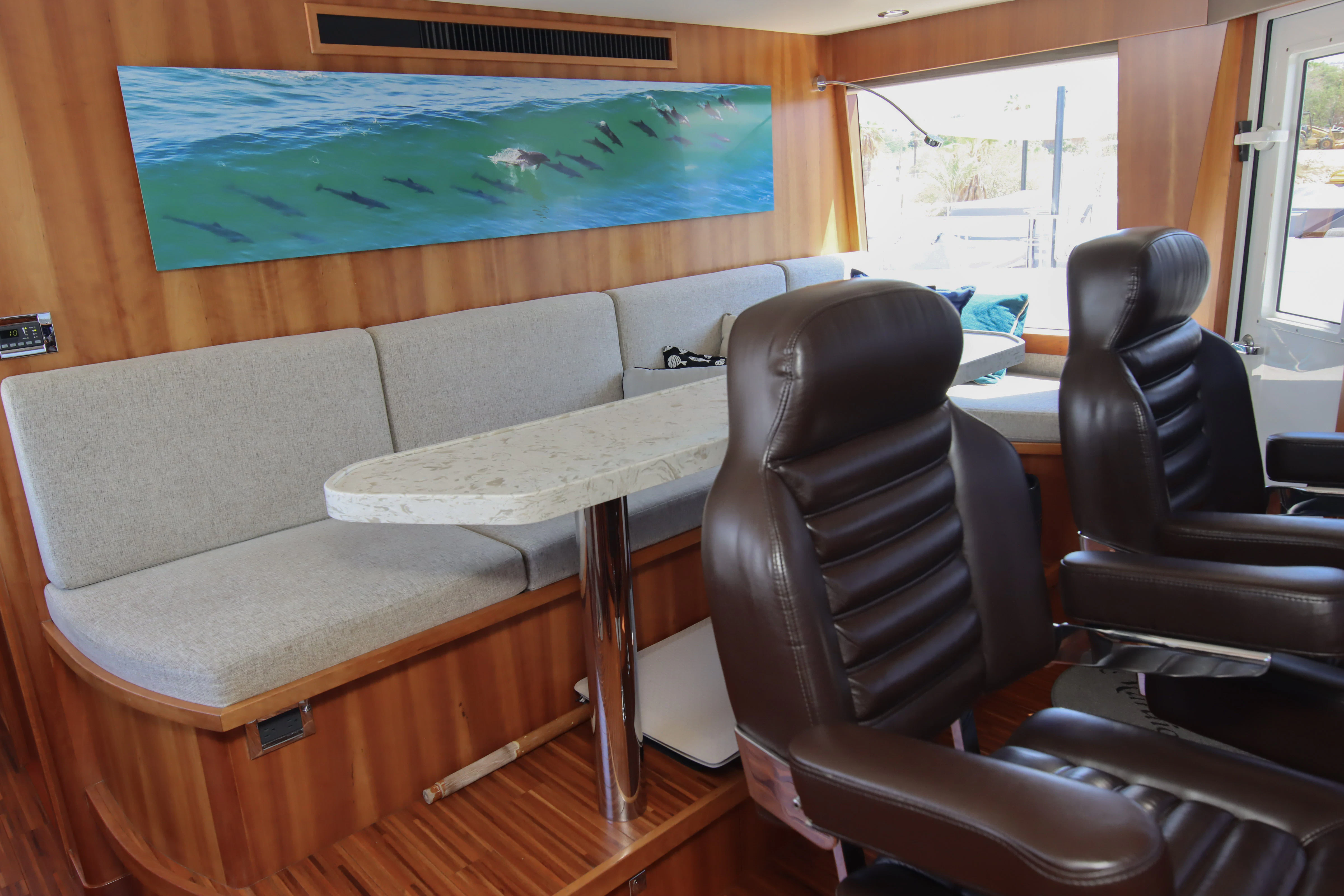 a room with a table and chairs aboard MARDIOSA Yacht for Sale