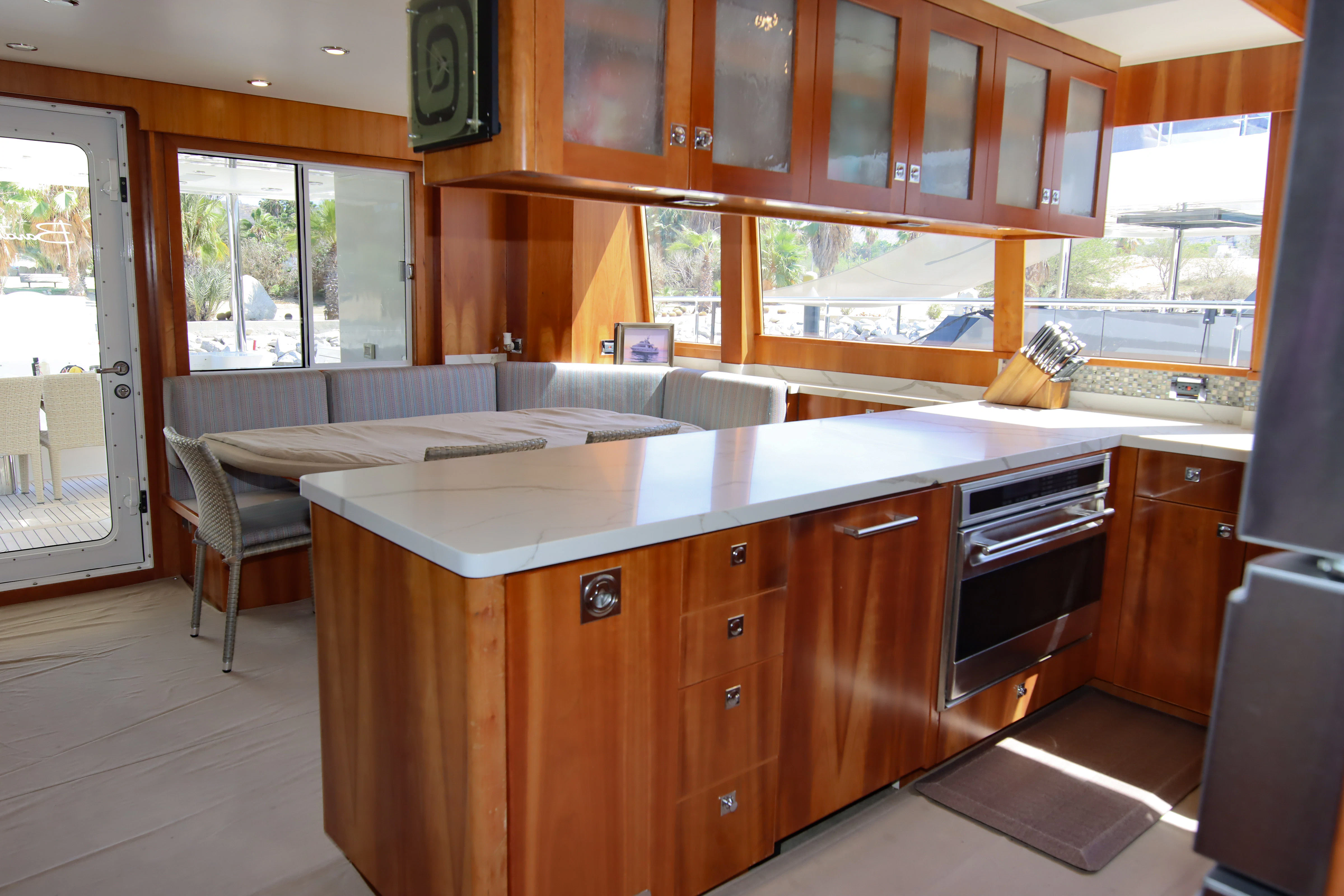 a kitchen with wooden cabinets aboard MARDIOSA Yacht for Sale