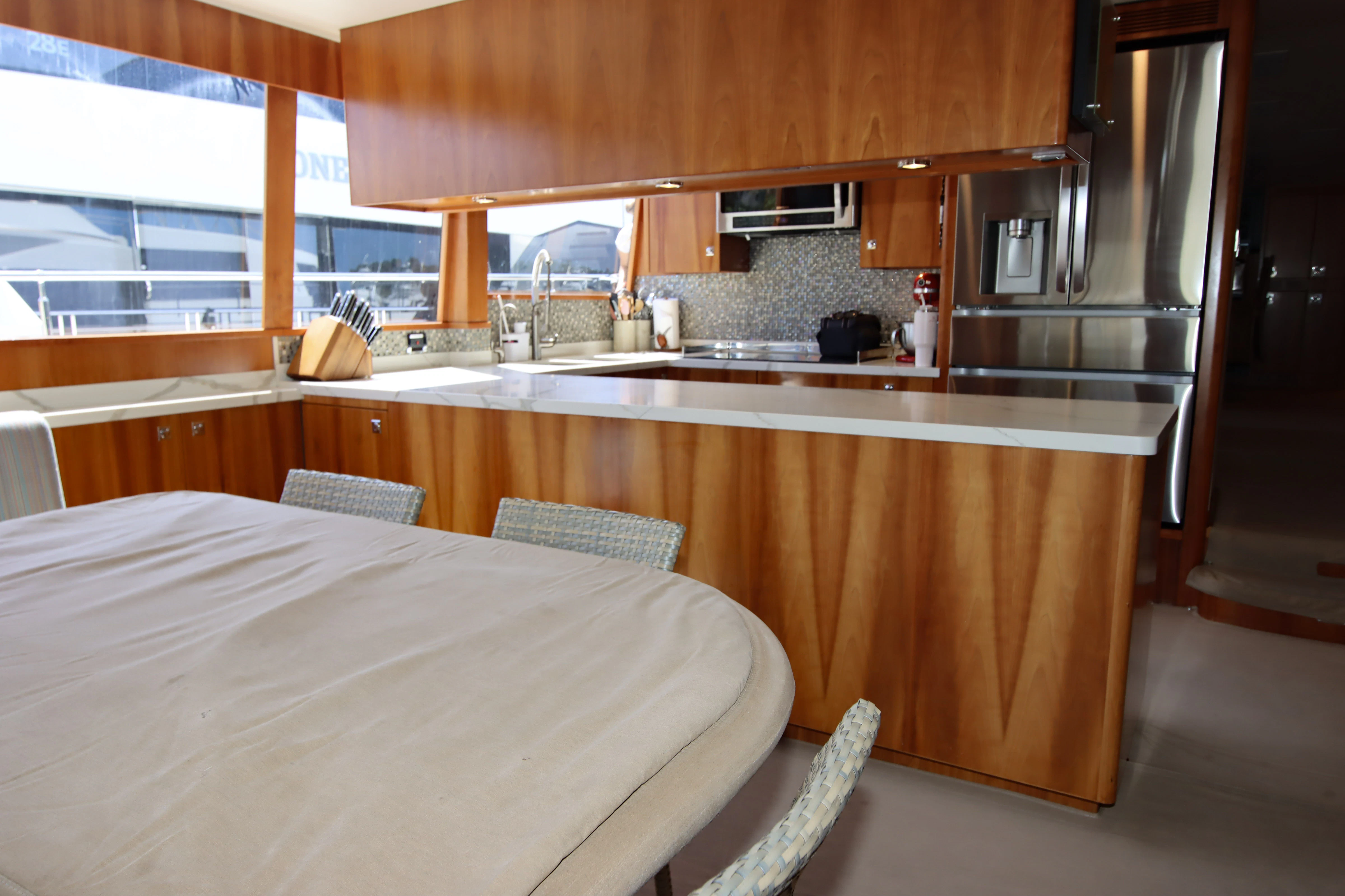 a kitchen with a table and a sink aboard MARDIOSA Yacht for Sale