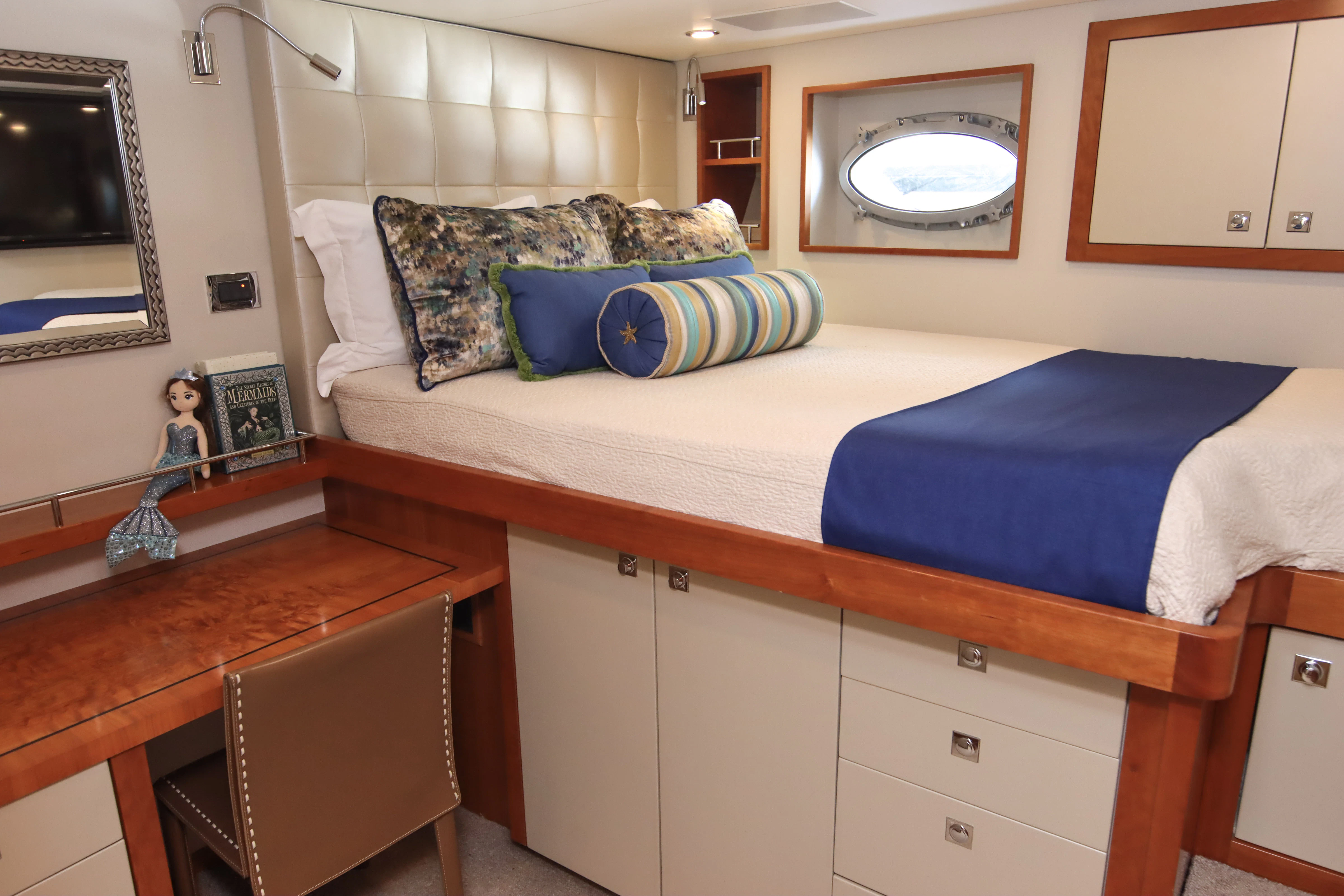 a bed with a blue sheet aboard MARDIOSA Yacht for Sale