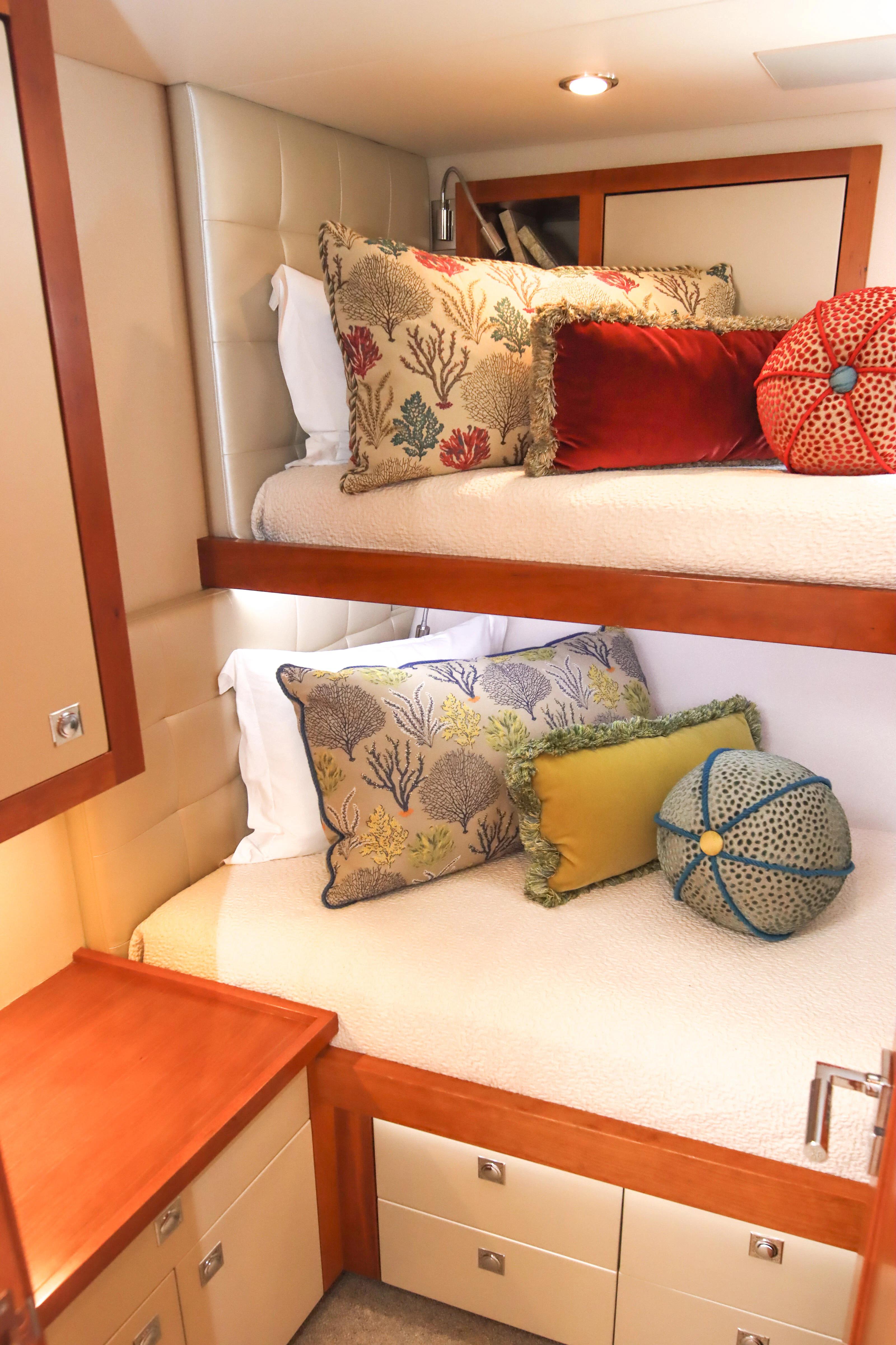 a bed with colorful pillows aboard MARDIOSA Yacht for Sale