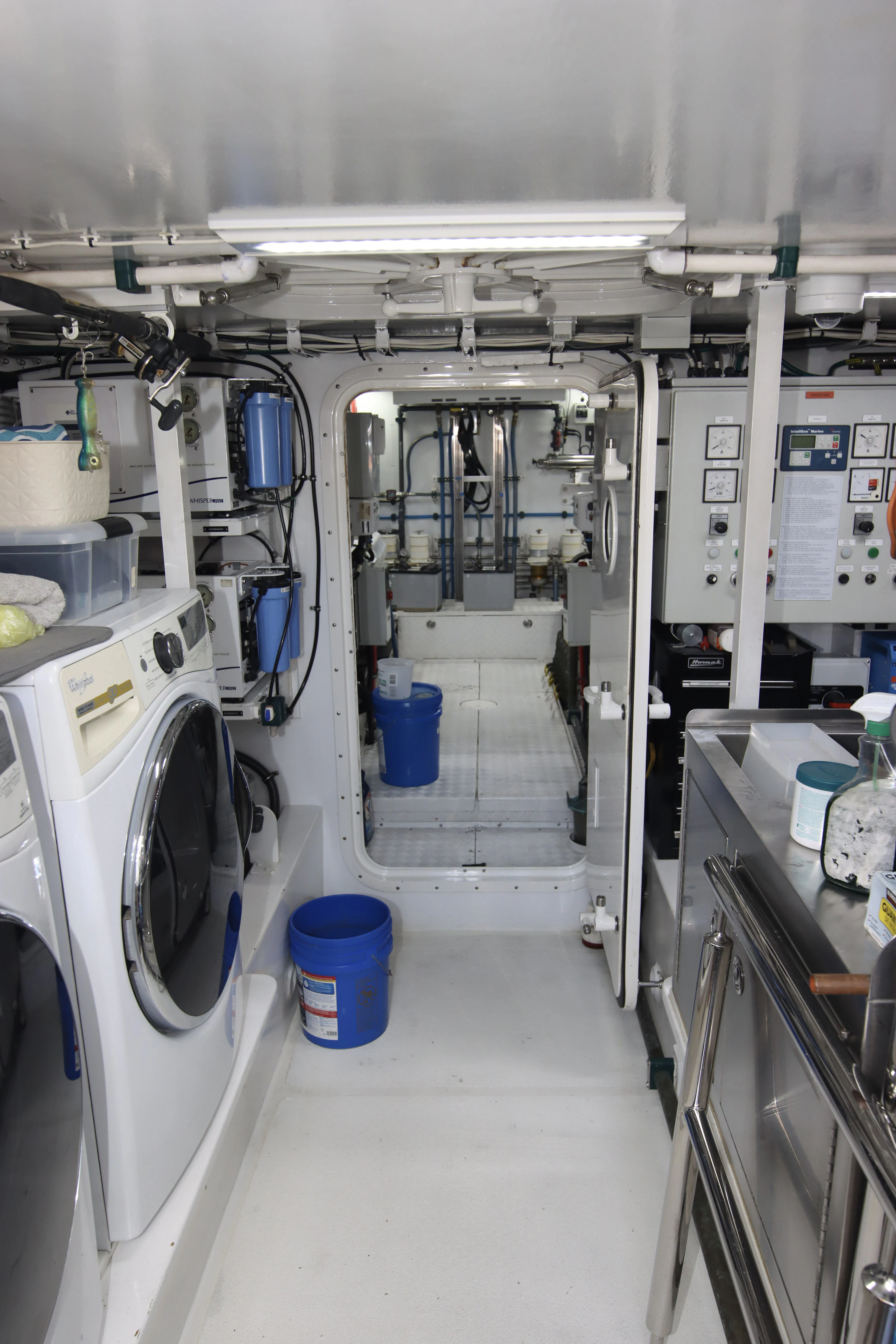 a room with machines and shelves aboard MARDIOSA Yacht for Sale
