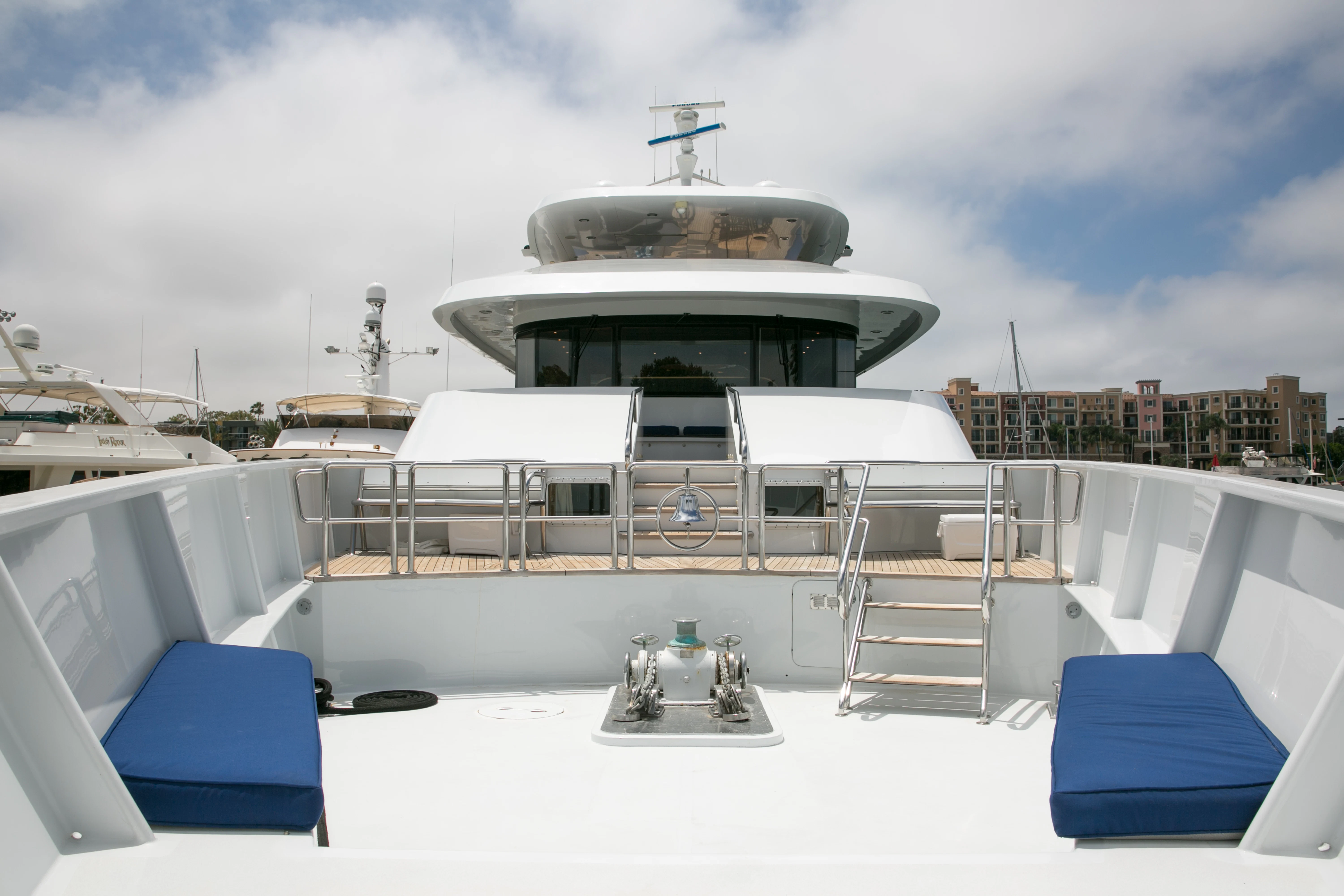 a white boat with a ladder on a deck aboard AURORA Yacht for Sale