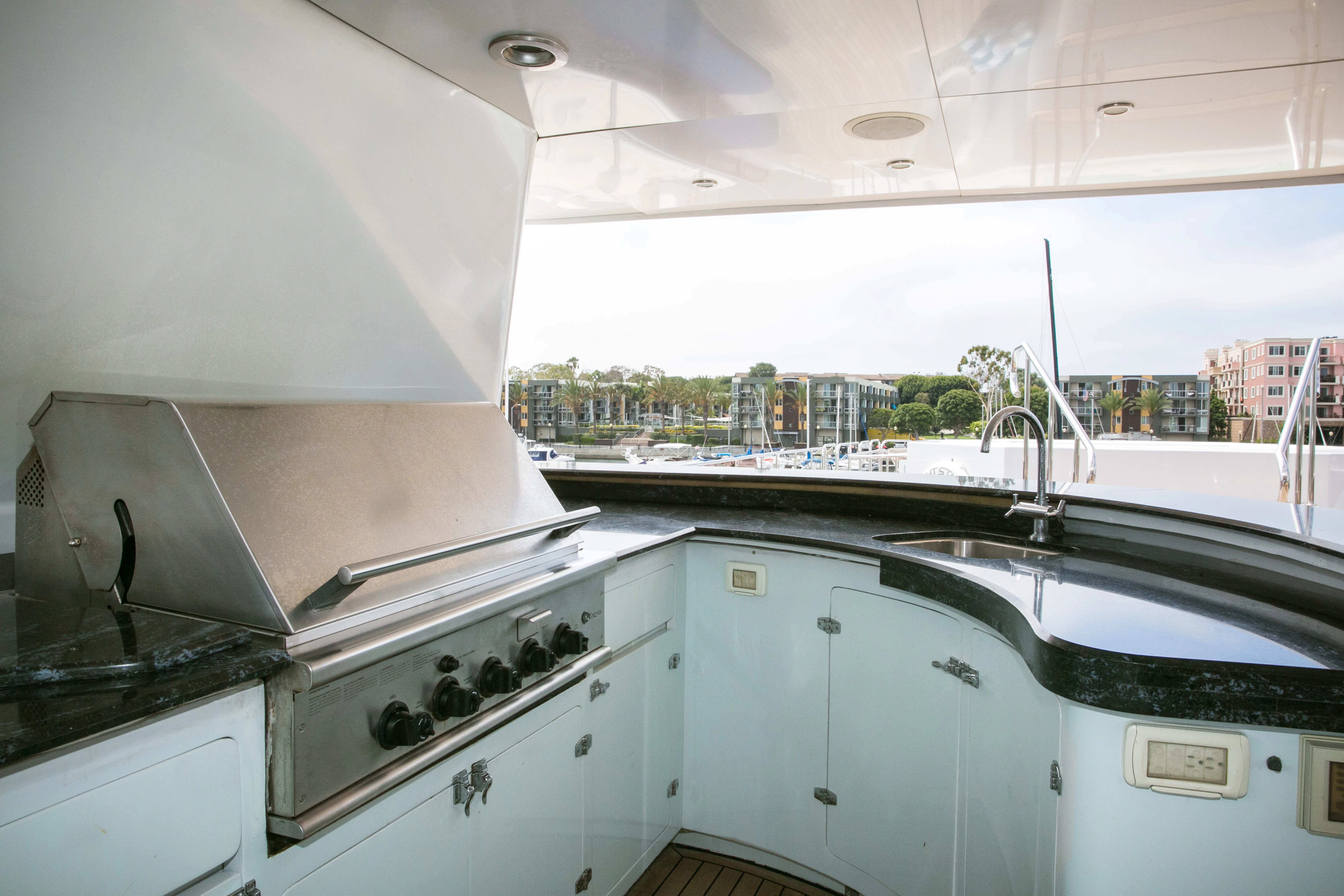 a kitchen with a large window aboard AURORA Yacht for Sale