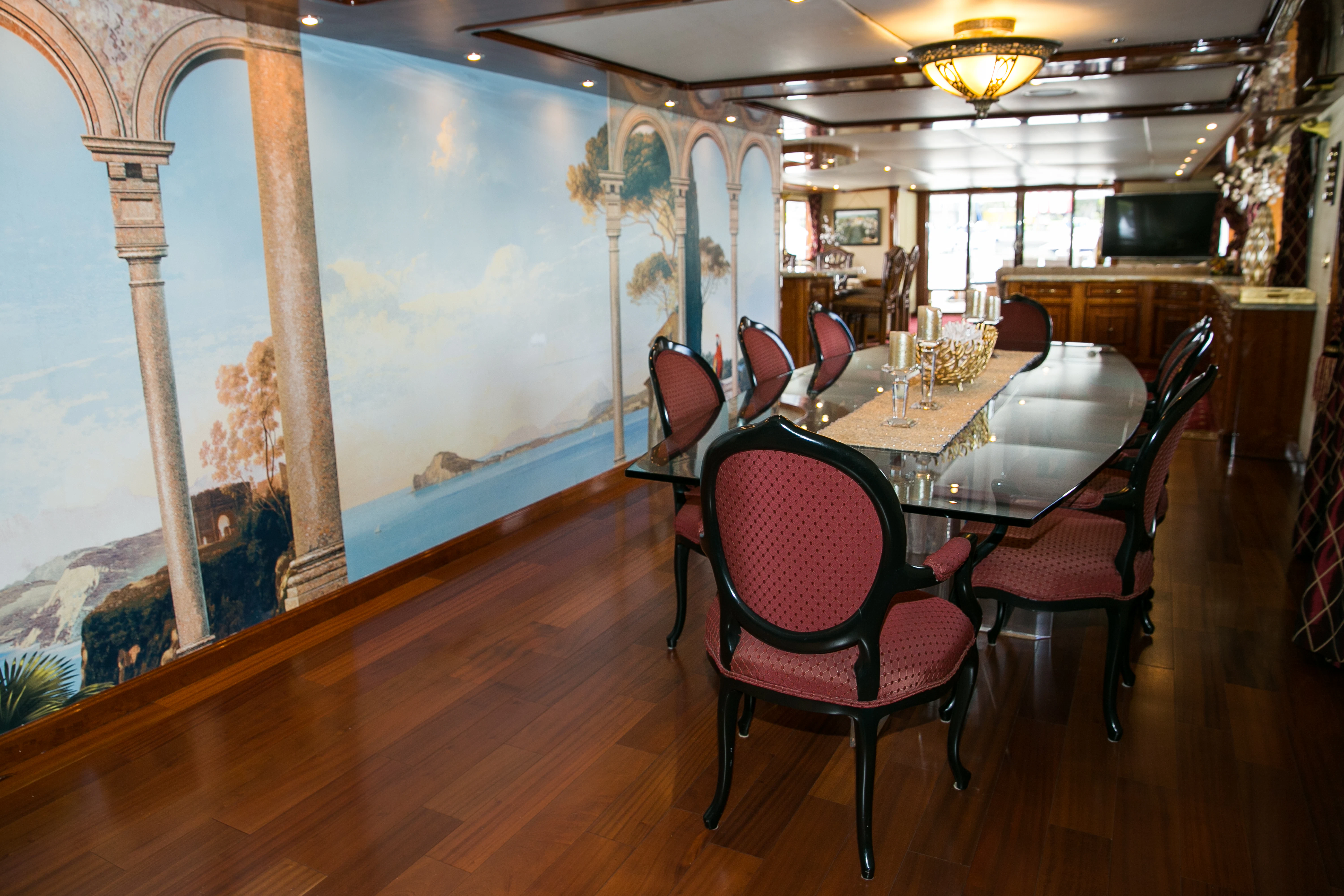 a dining room with a table and chairs aboard AURORA Yacht for Sale