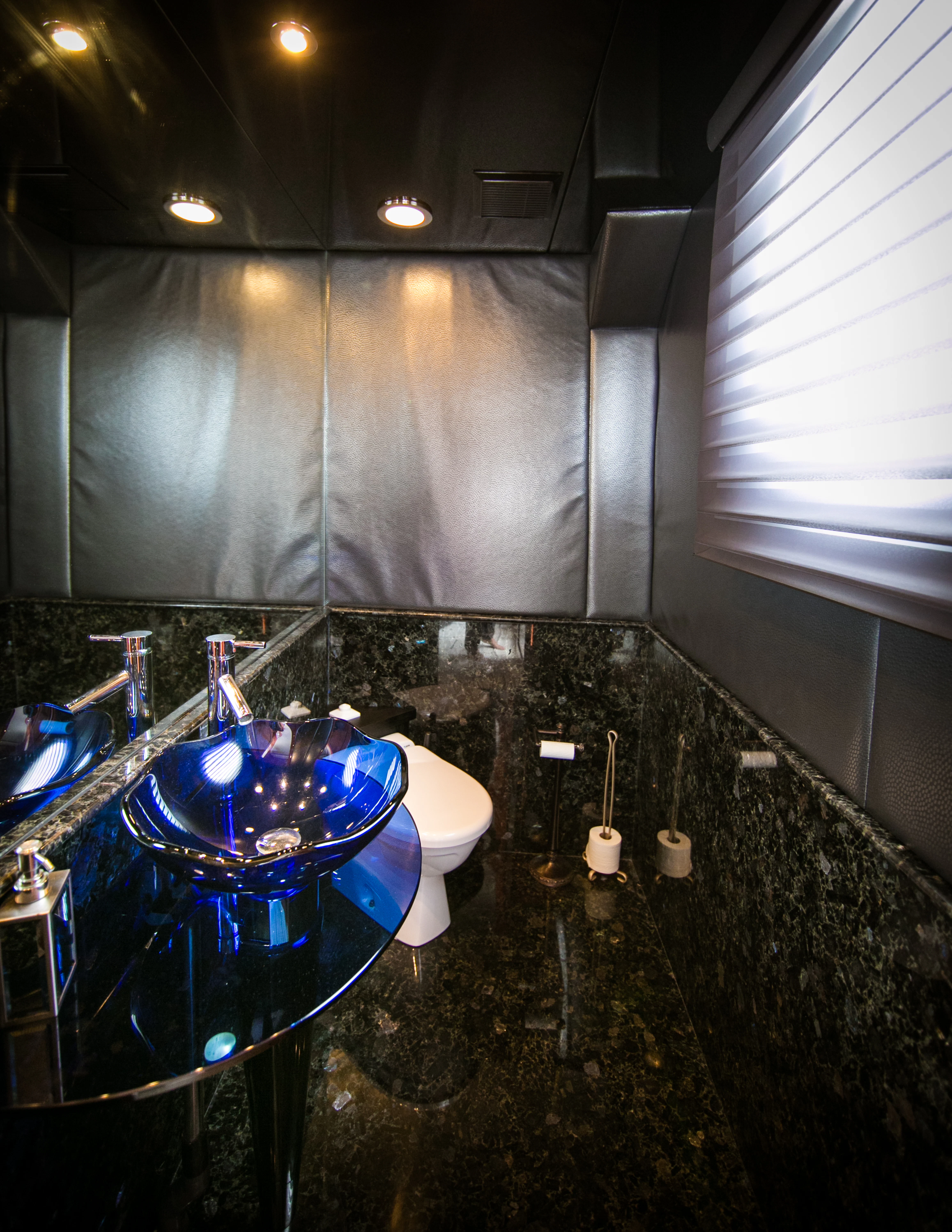 a bathroom with a blue sink aboard AURORA Yacht for Sale