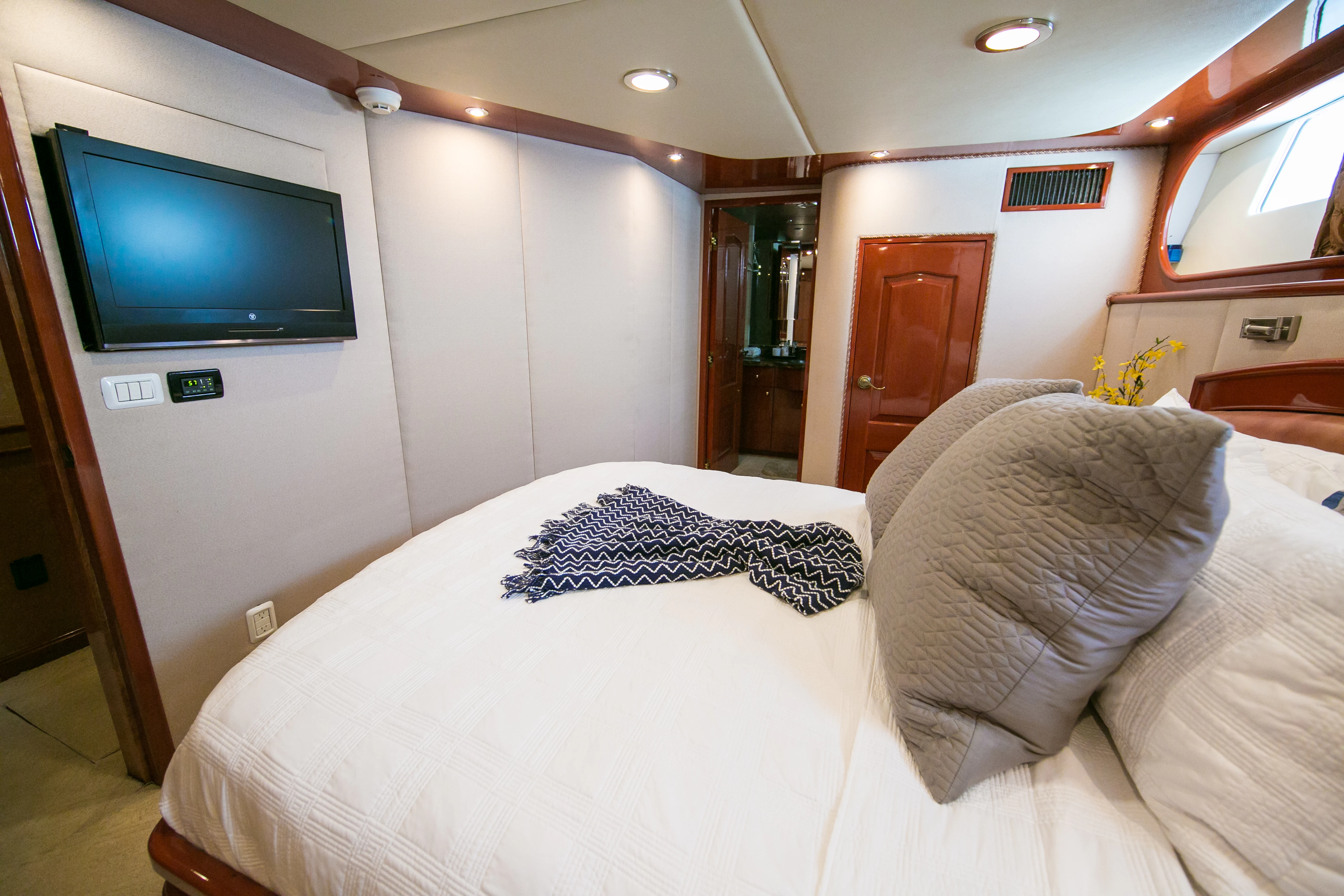 a bed with pillows aboard AURORA Yacht for Sale