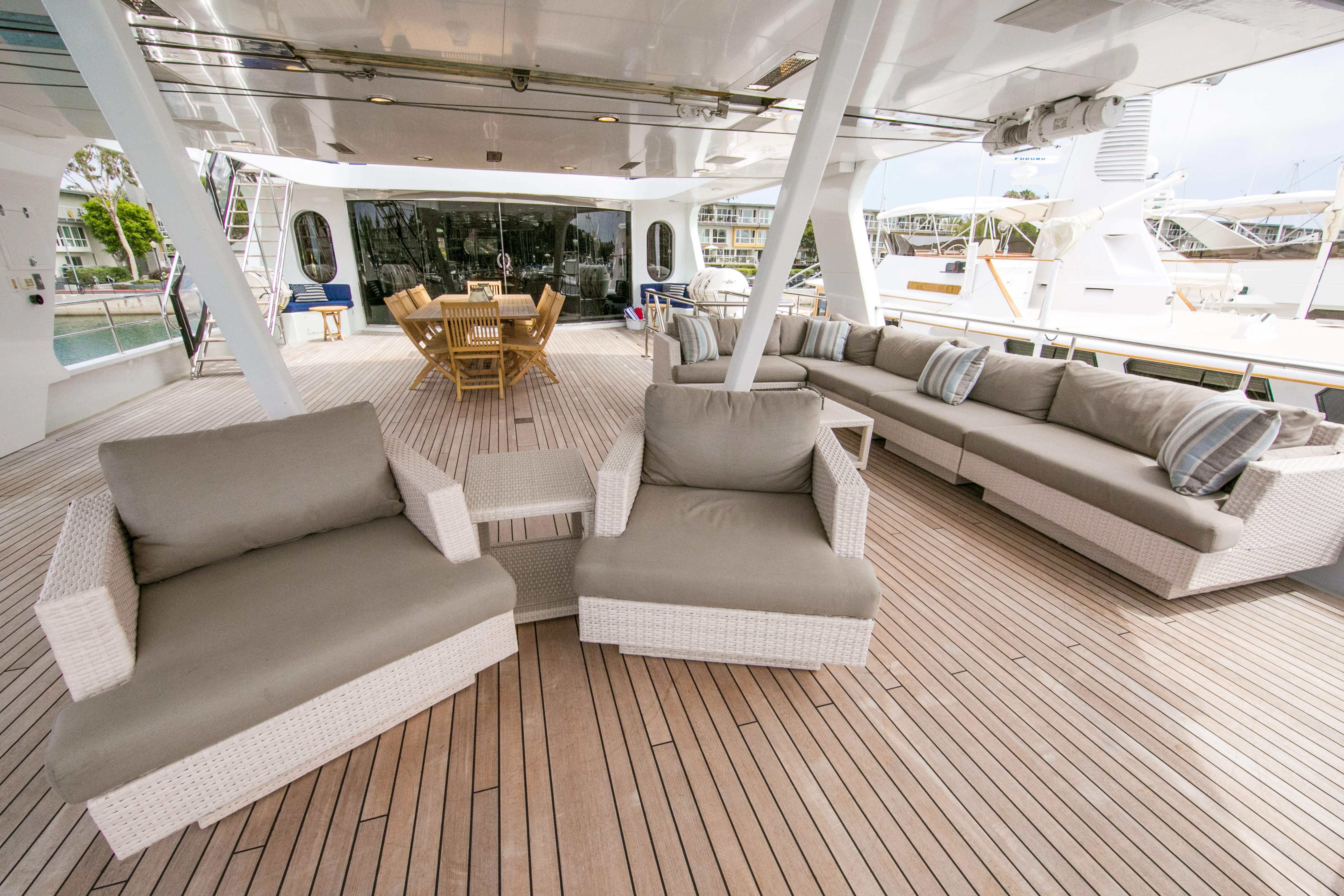 a living room with a couch and a table aboard AURORA Yacht for Sale