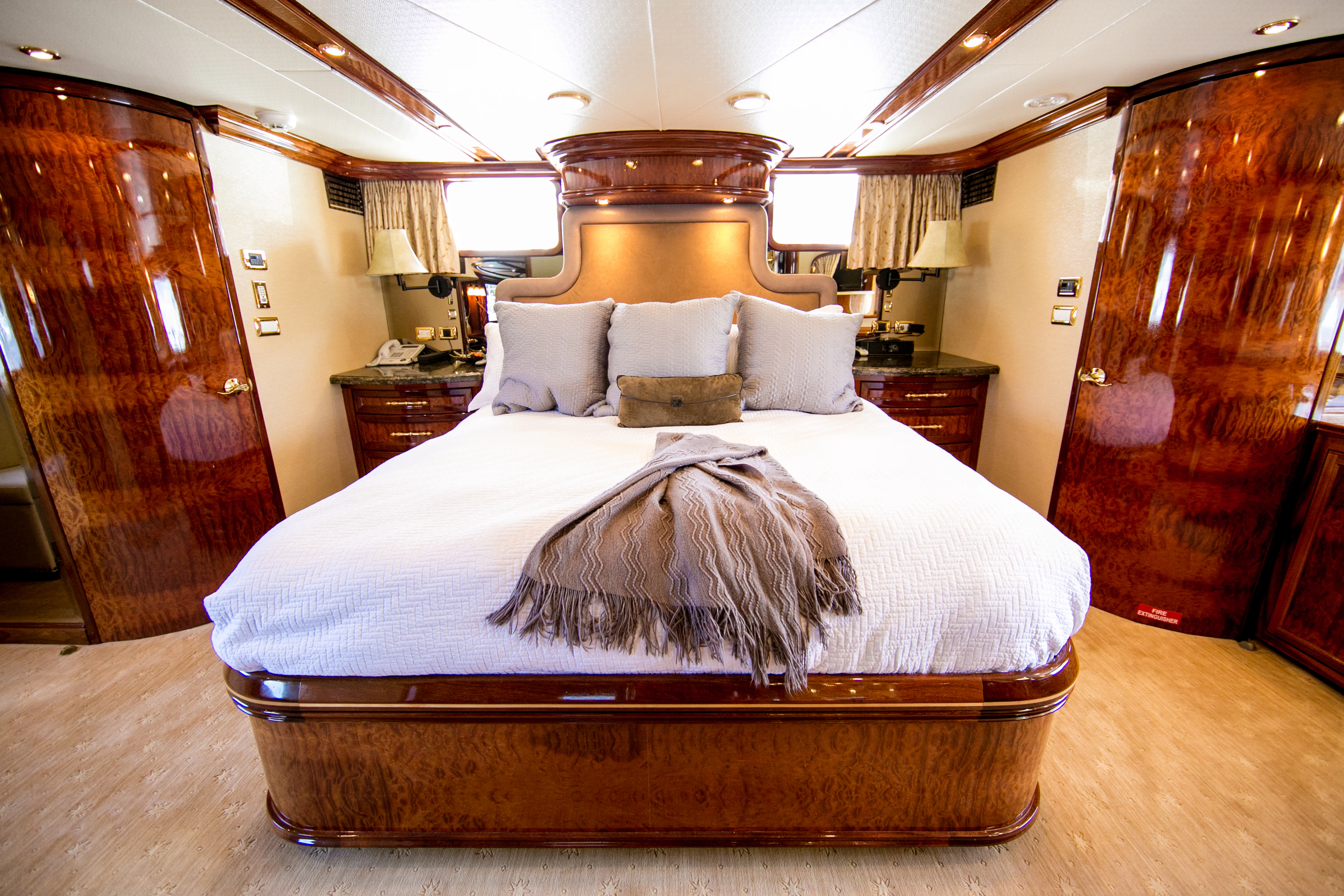 a large bed in a room aboard AURORA Yacht for Sale