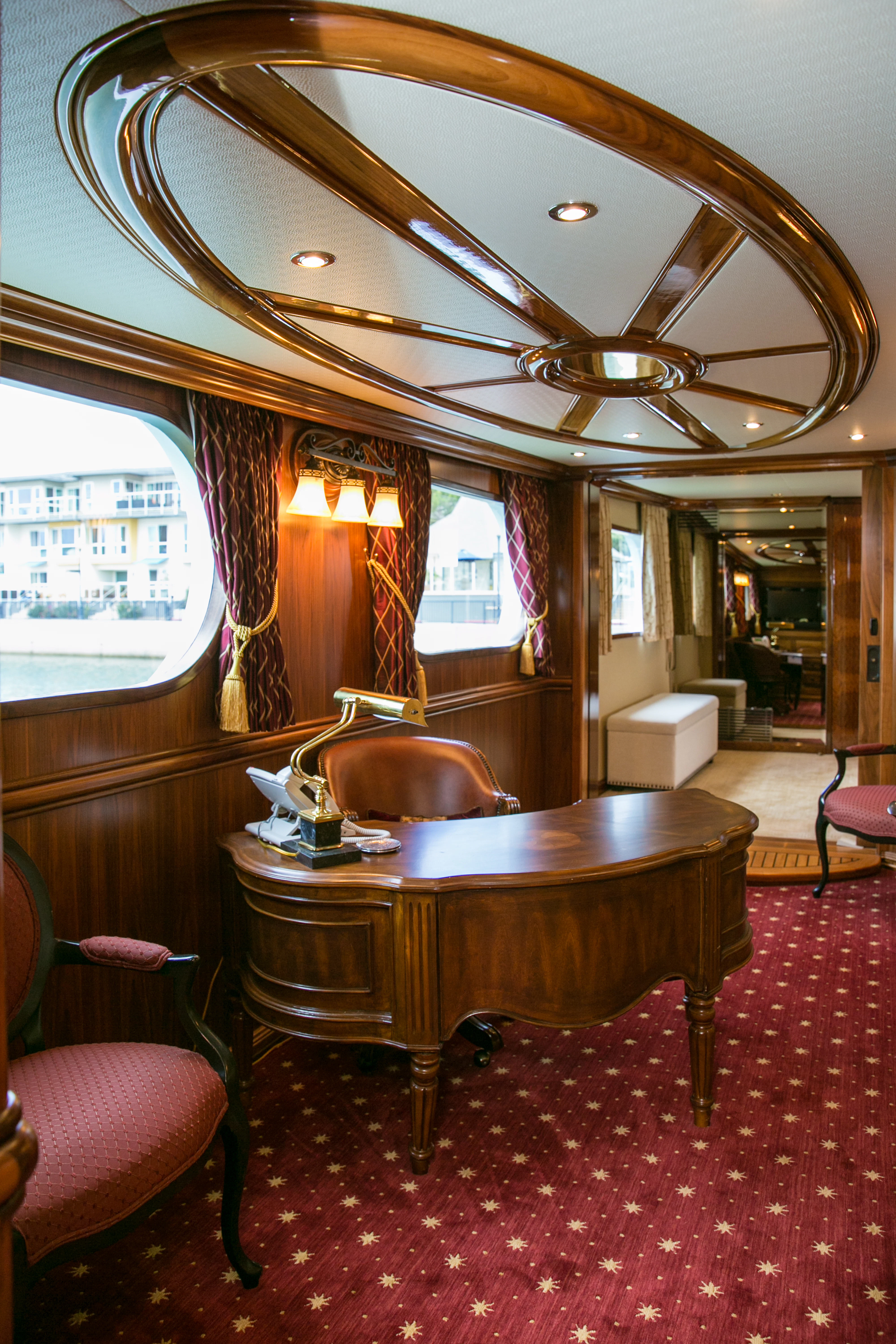 a large room with a table and chairs aboard AURORA Yacht for Sale