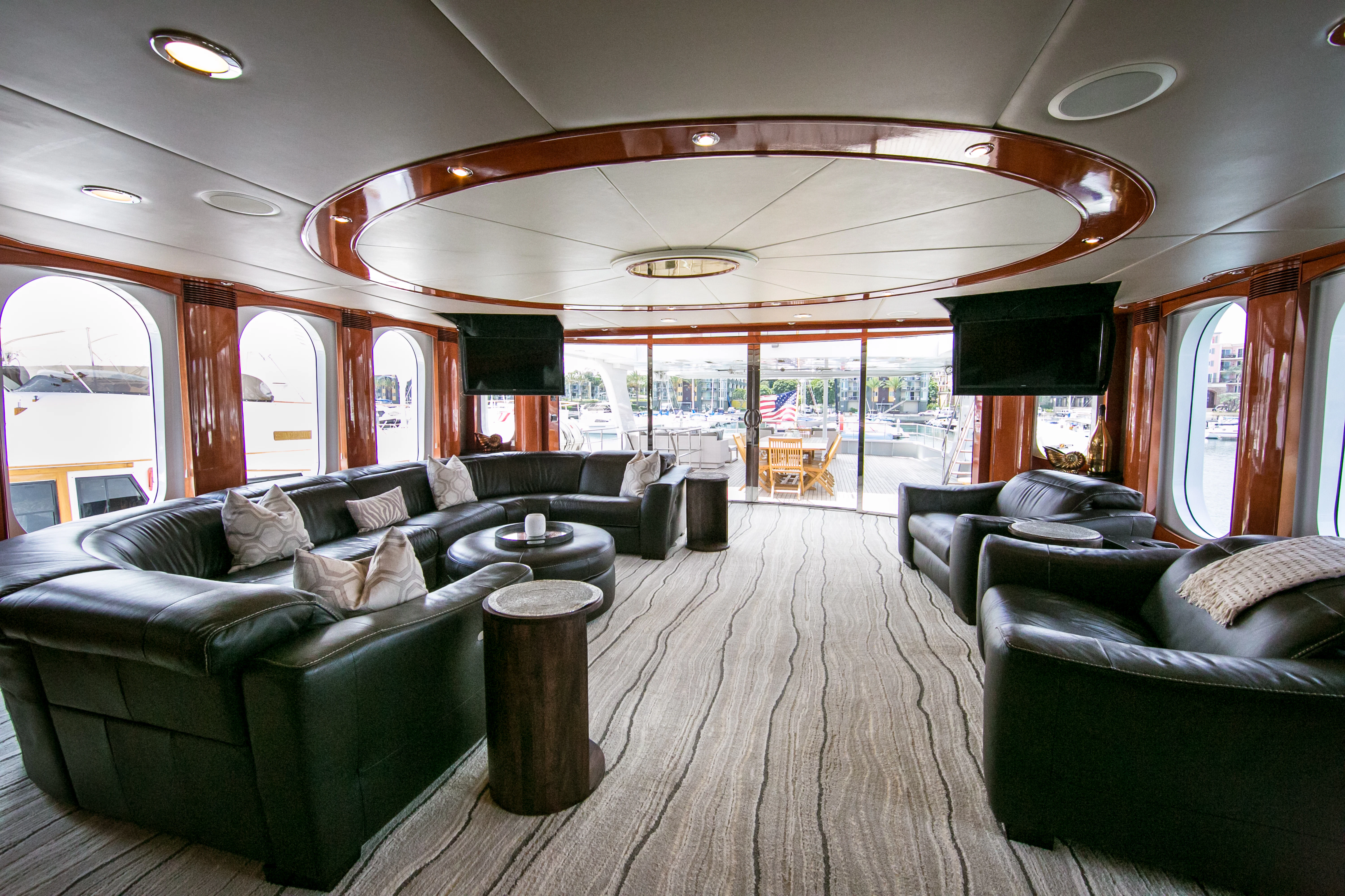 a large living room with a large glass ceiling aboard AURORA Yacht for Sale