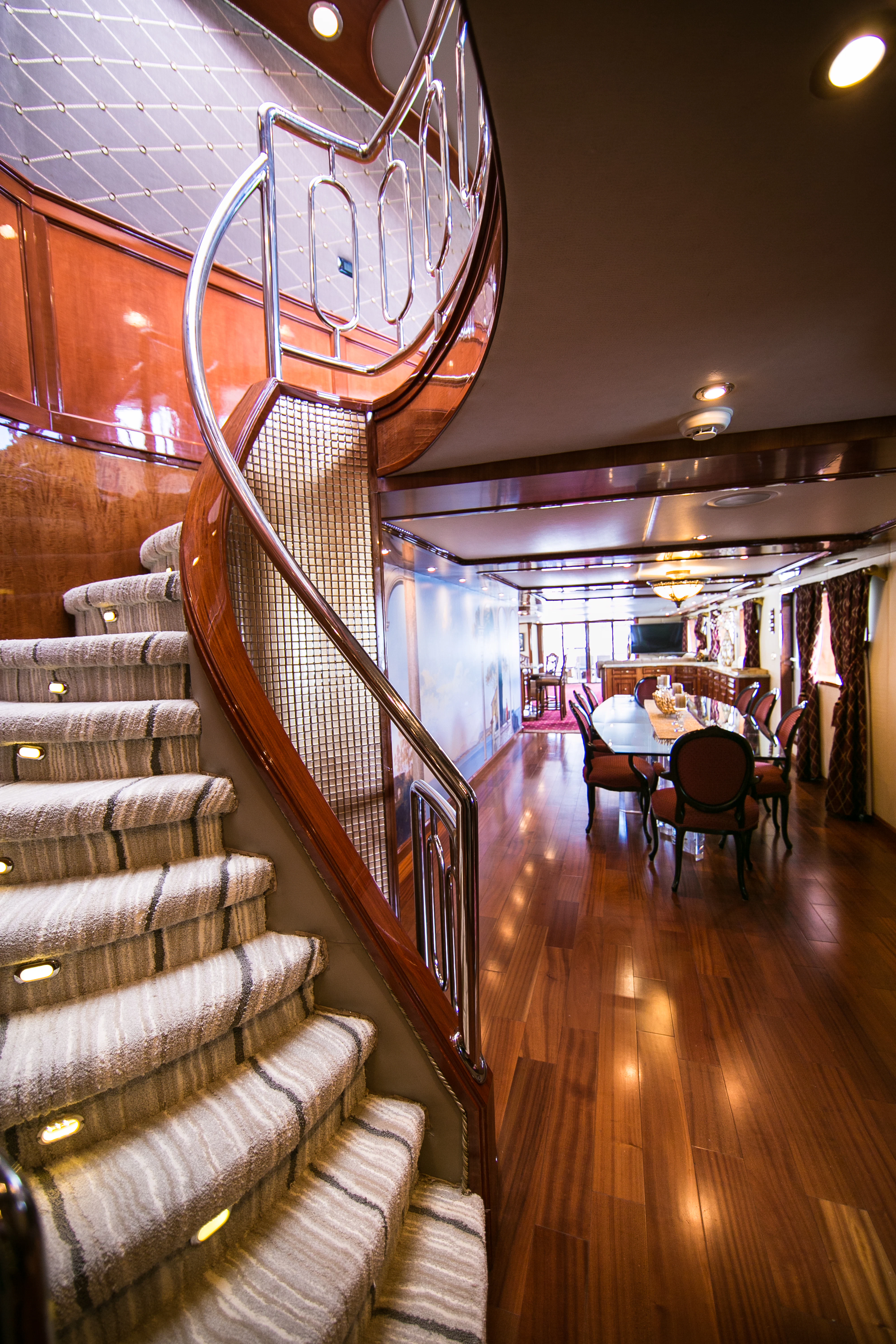 a staircase with a wood railing aboard AURORA Yacht for Sale