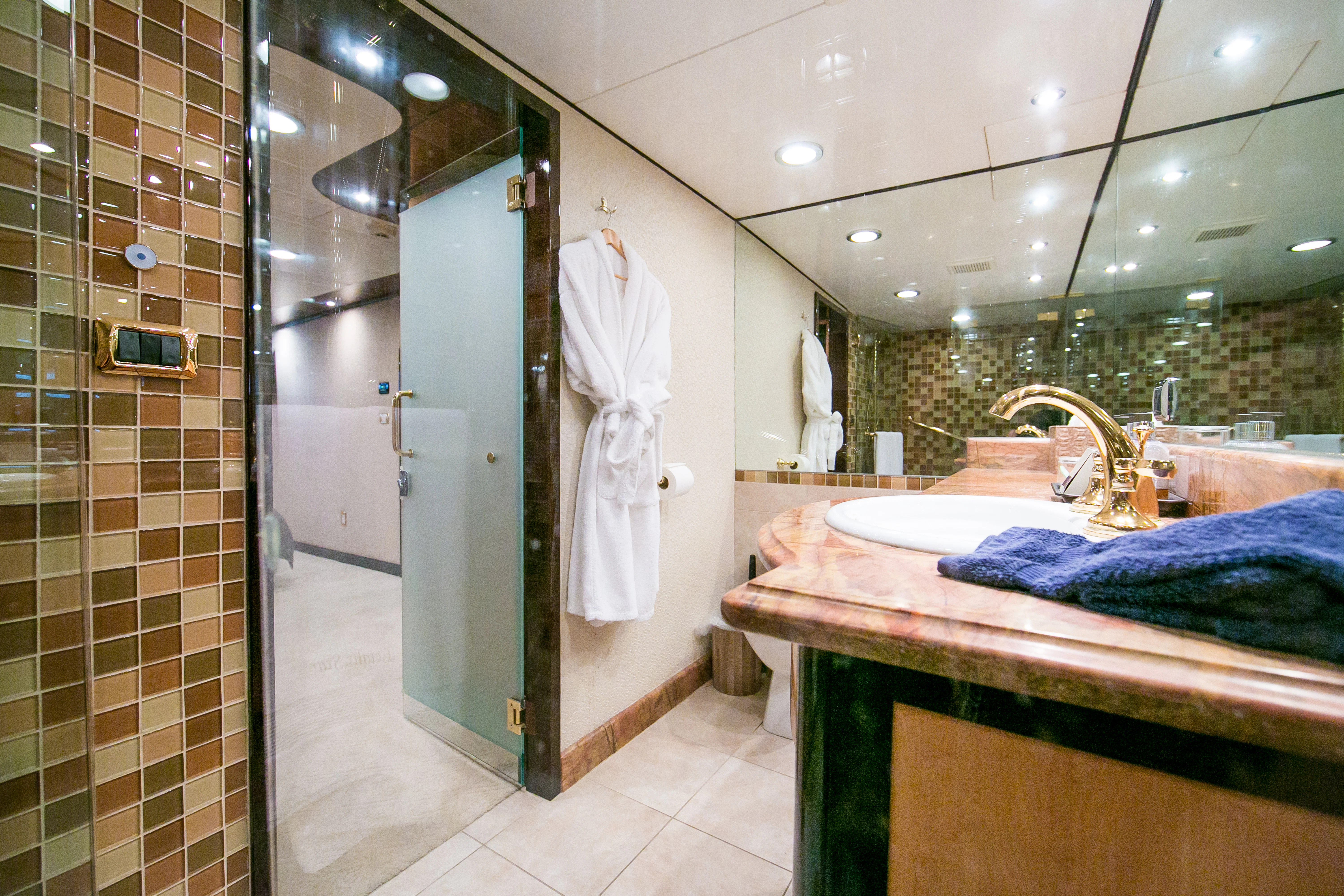 a bathroom with a large mirror aboard AURORA Yacht for Sale