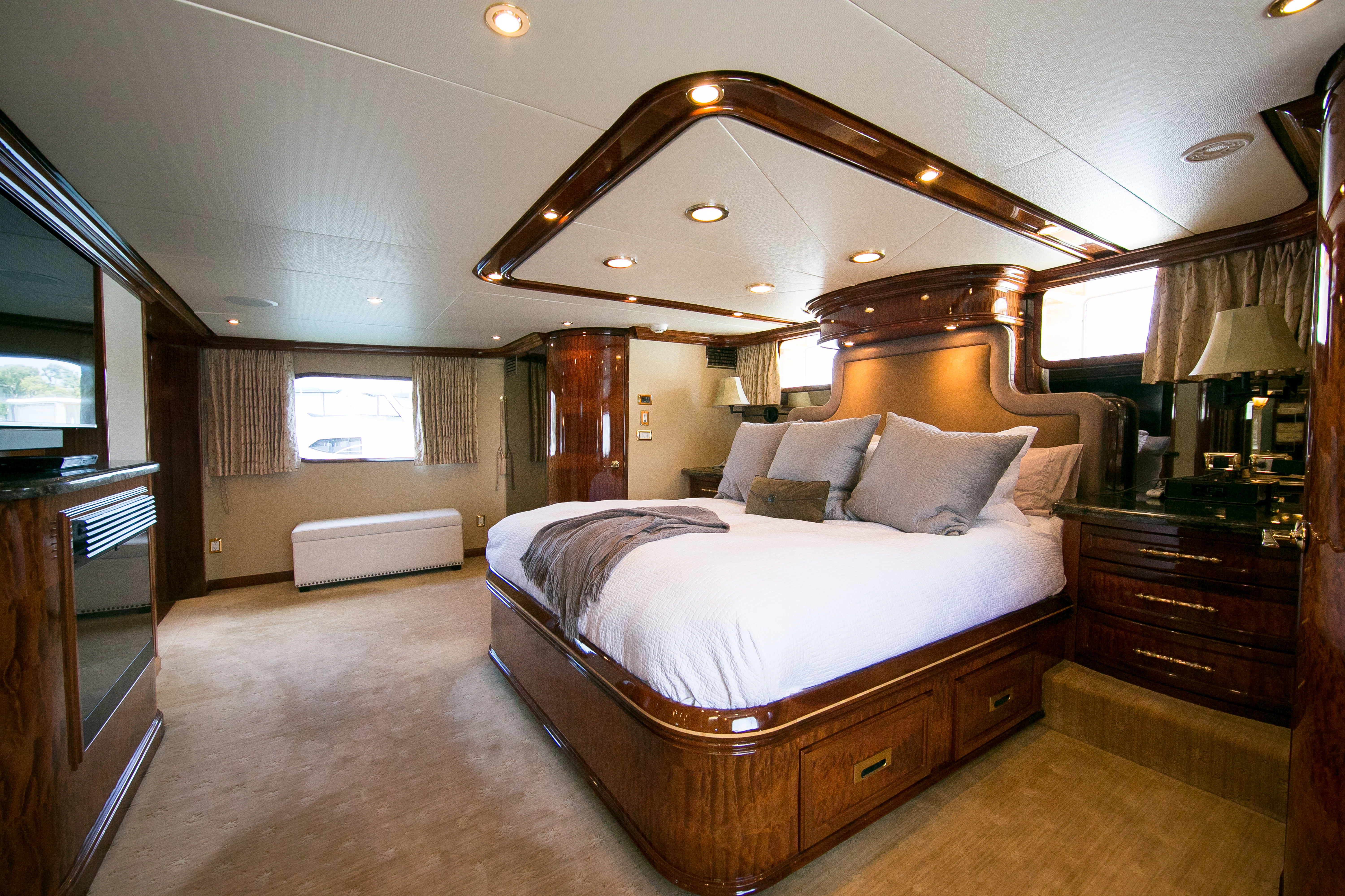 a large bed in a room aboard AURORA Yacht for Sale