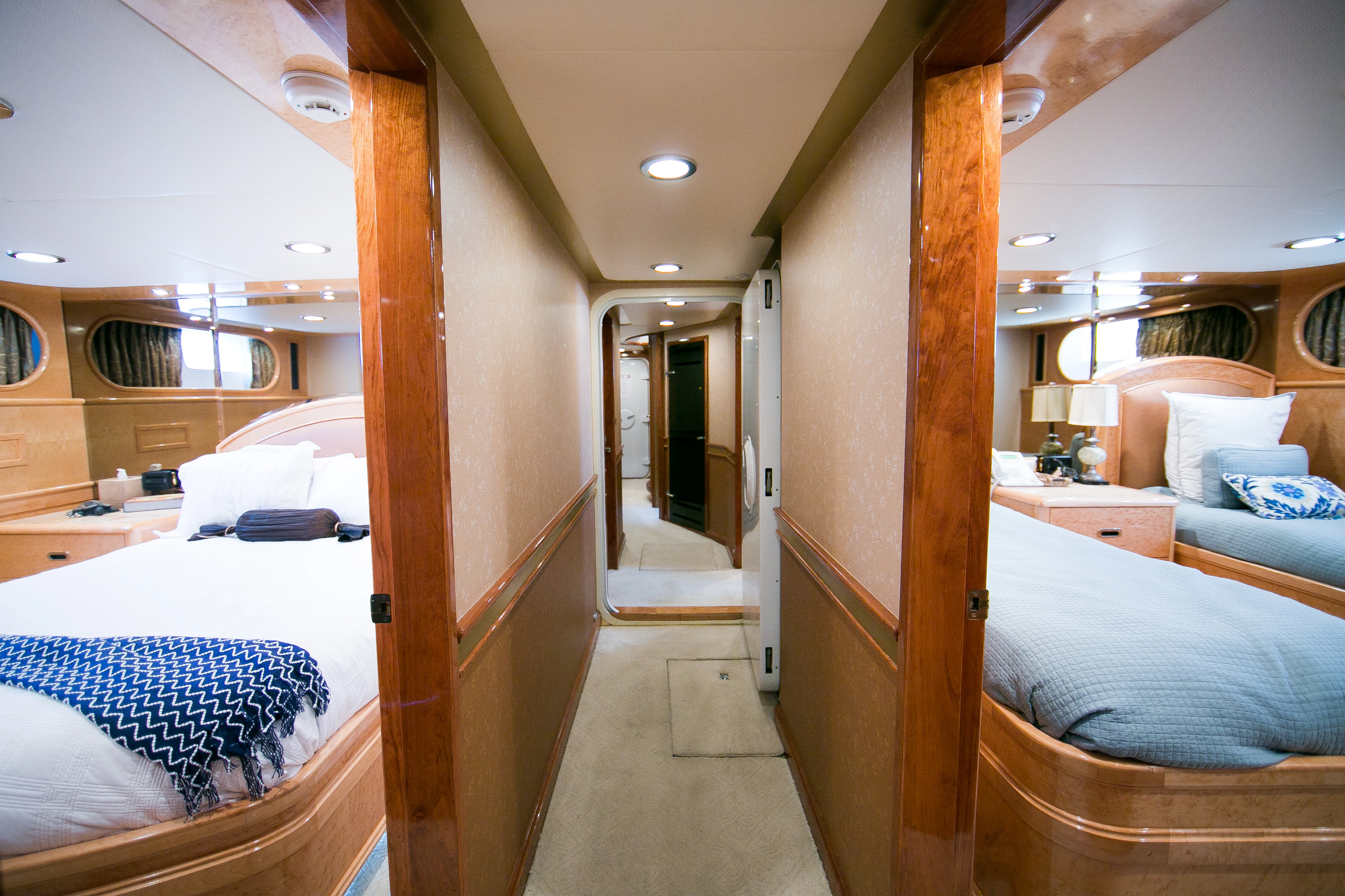 a room with a bed and a door aboard AURORA Yacht for Sale