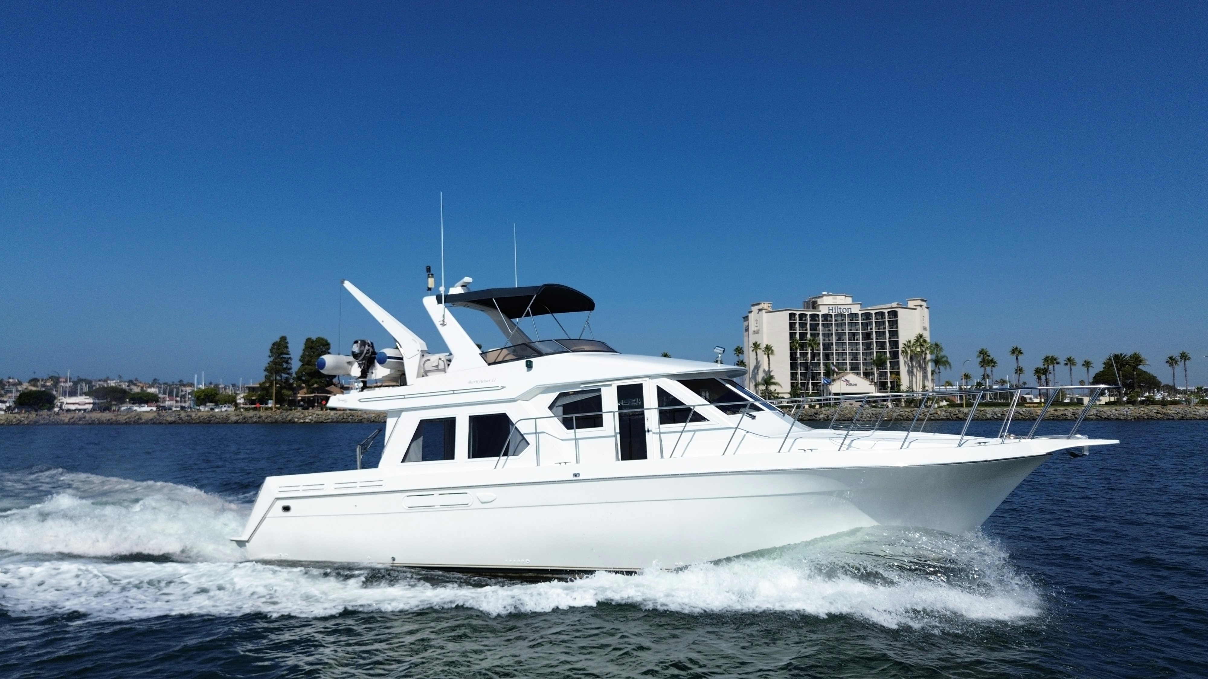 a white boat on the water aboard BARKRUISER Yacht for Sale