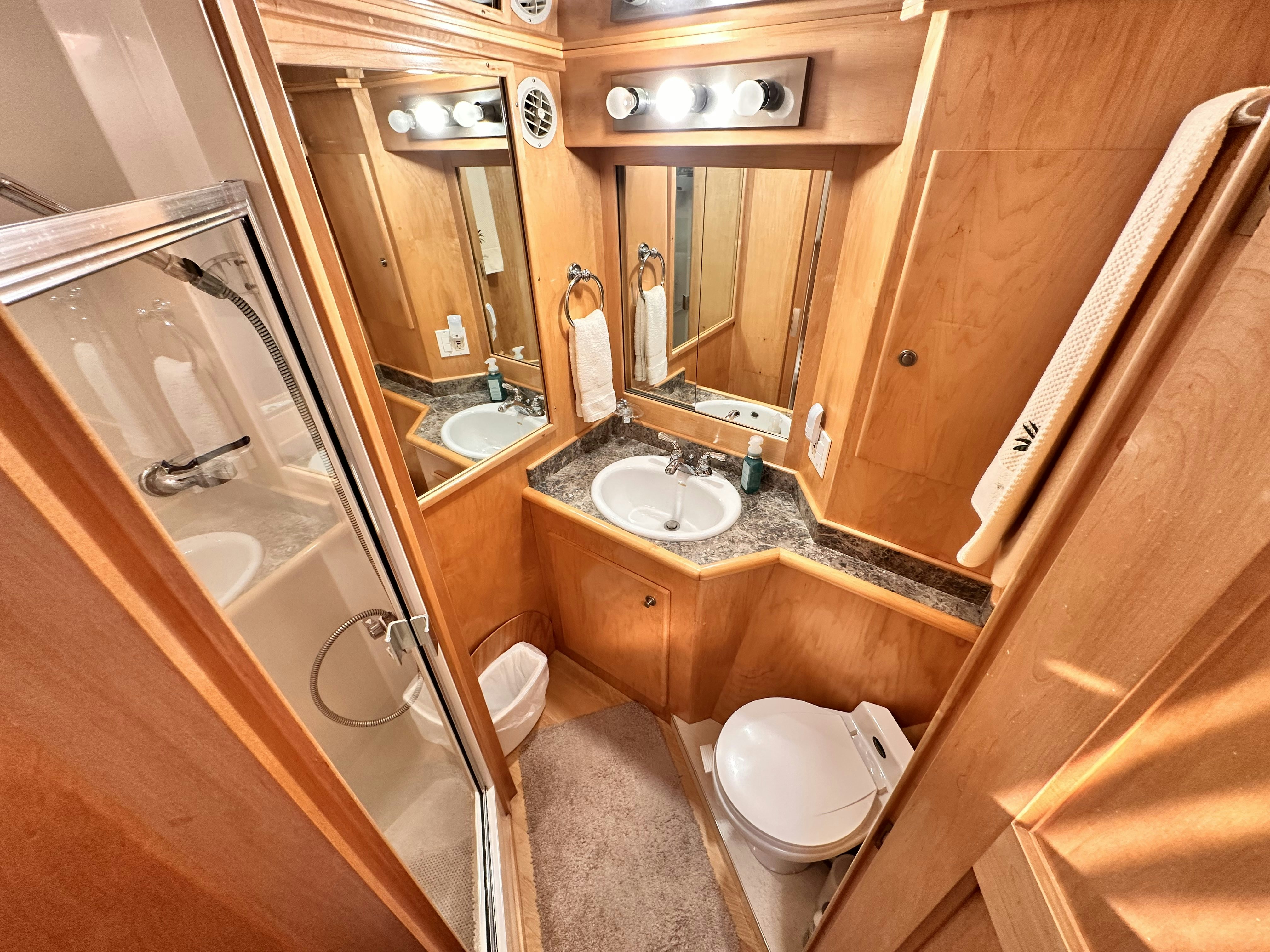 a bathroom with a sink and toilet aboard BARKRUISER Yacht for Sale