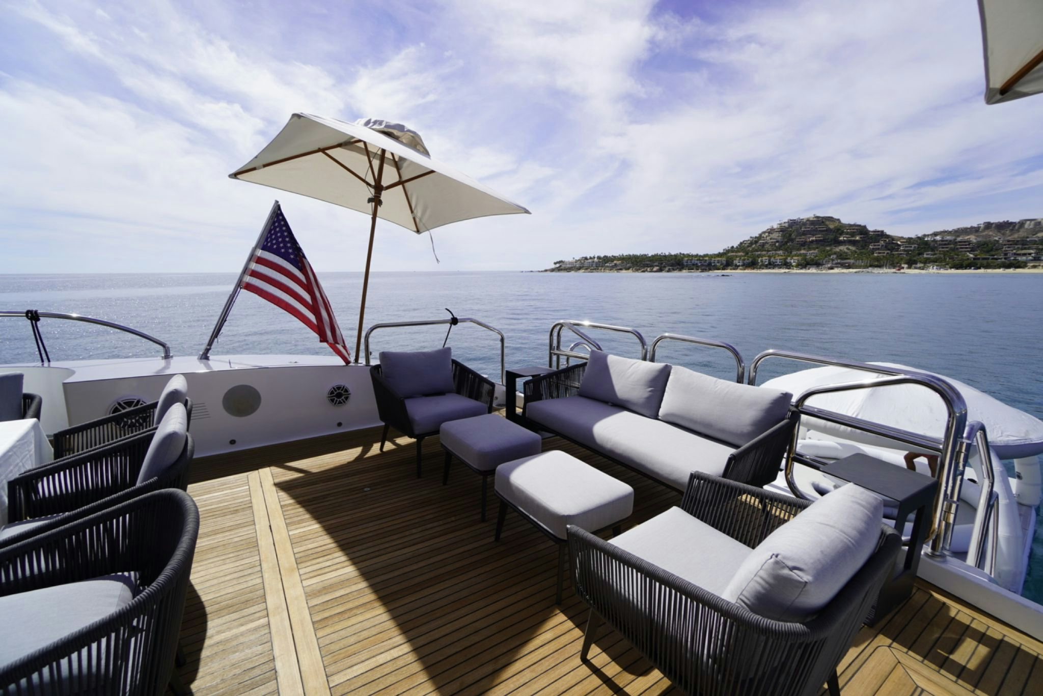 a boat with chairs and umbrellas on it aboard GO Yacht for Sale