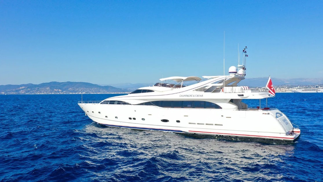 a white yacht in the water aboard CHAMPAGNE & CAVIAR Yacht for Charter