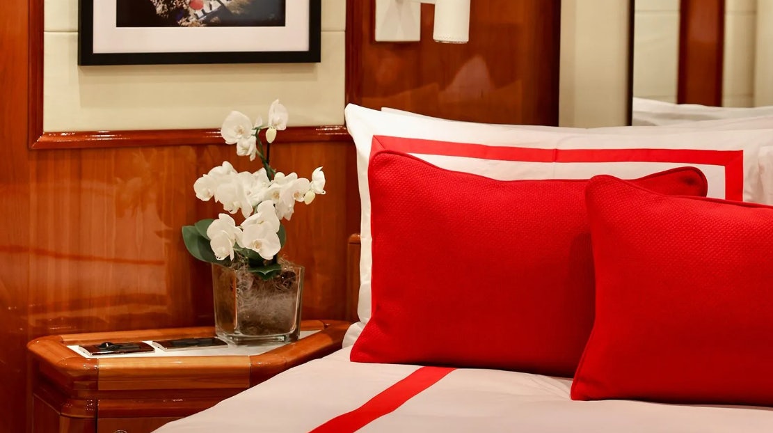 a vase of flowers on a table aboard CHAMPAGNE & CAVIAR Yacht for Charter