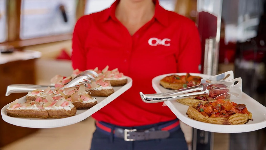 a person eating a plate of food aboard CHAMPAGNE & CAVIAR Yacht for Charter