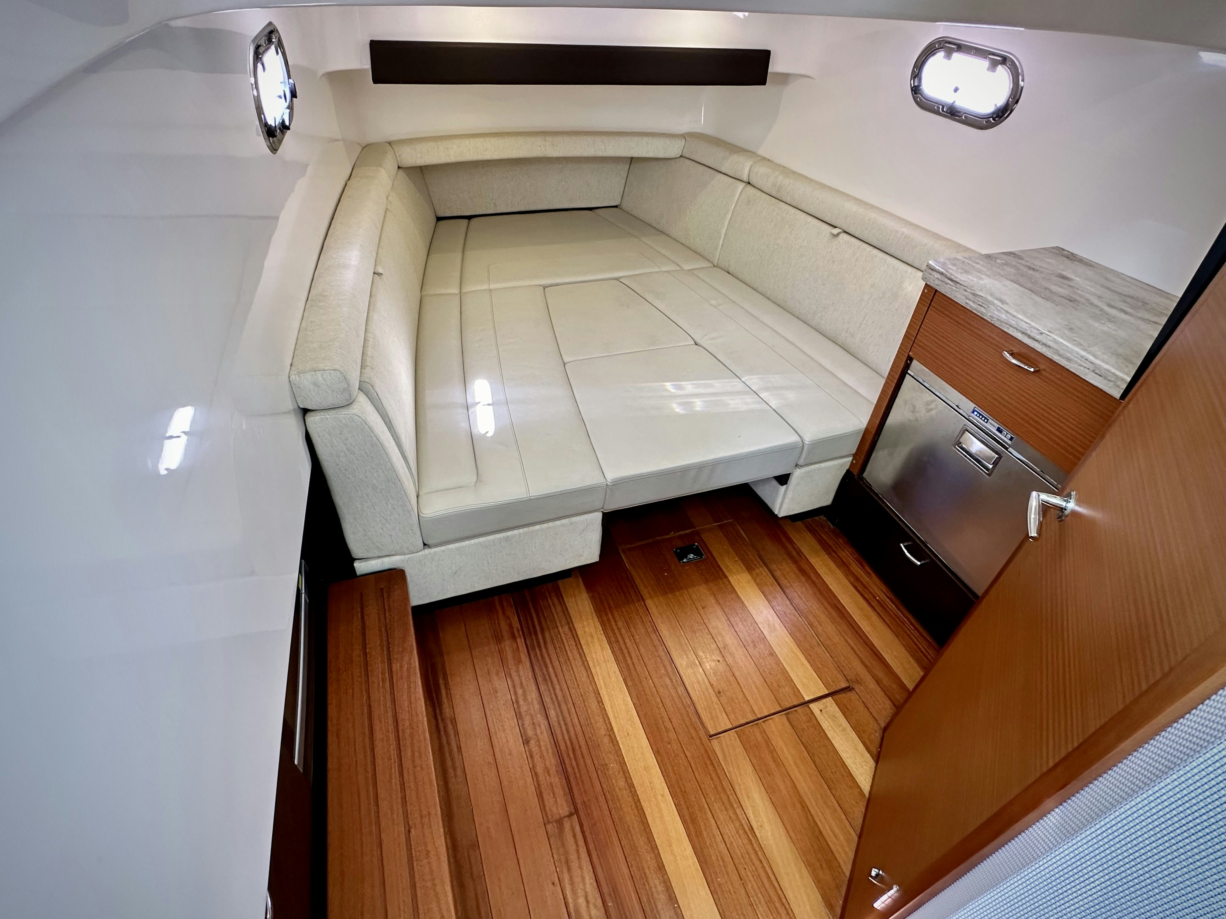 a white bed with drawers aboard PURSUIT S 408 Yacht for Sale