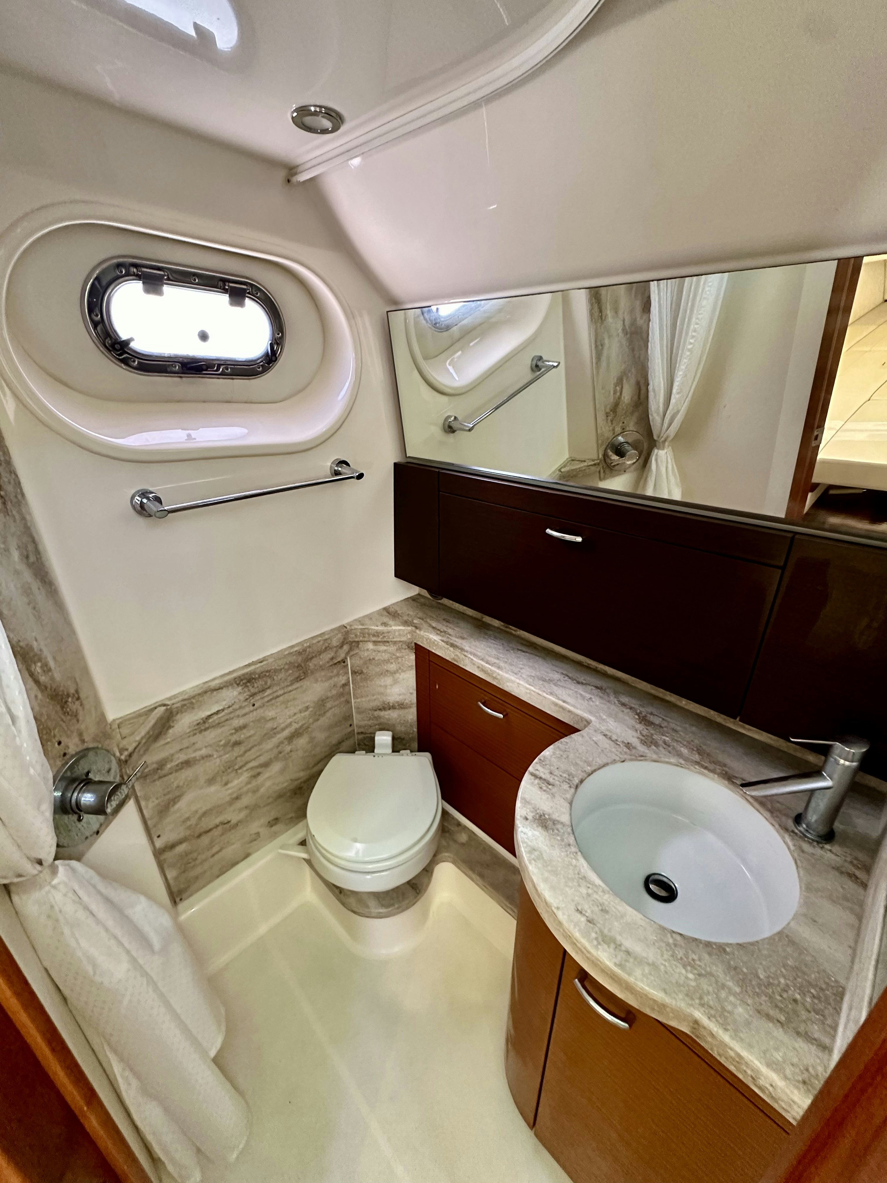 a bathroom with a sink and a toilet aboard PURSUIT S 408 Yacht for Sale