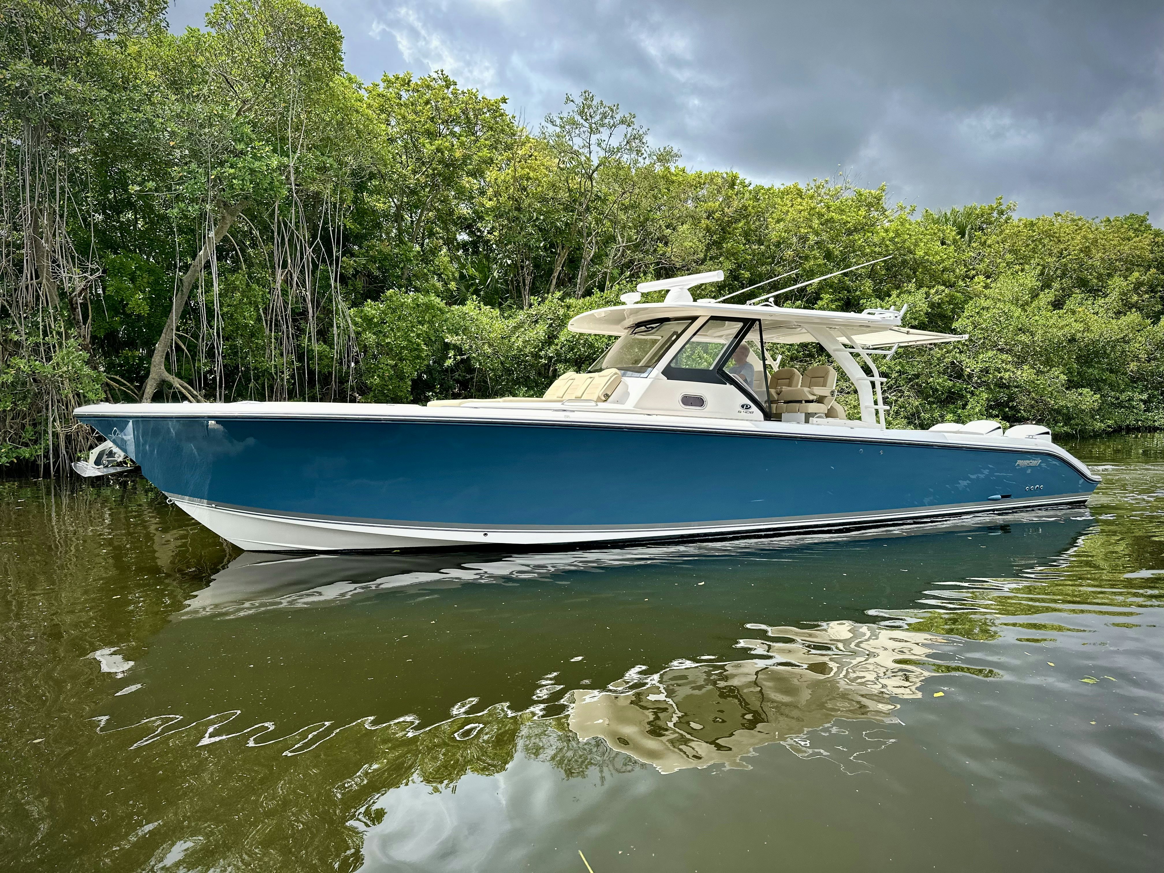 a boat on the water aboard PURSUIT S 408 Yacht for Sale