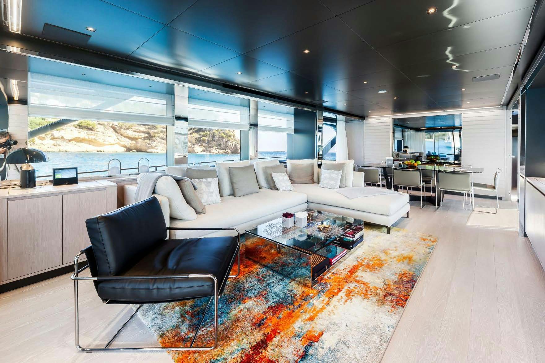 a living room with a large window aboard BARRACUDA III Yacht for Charter