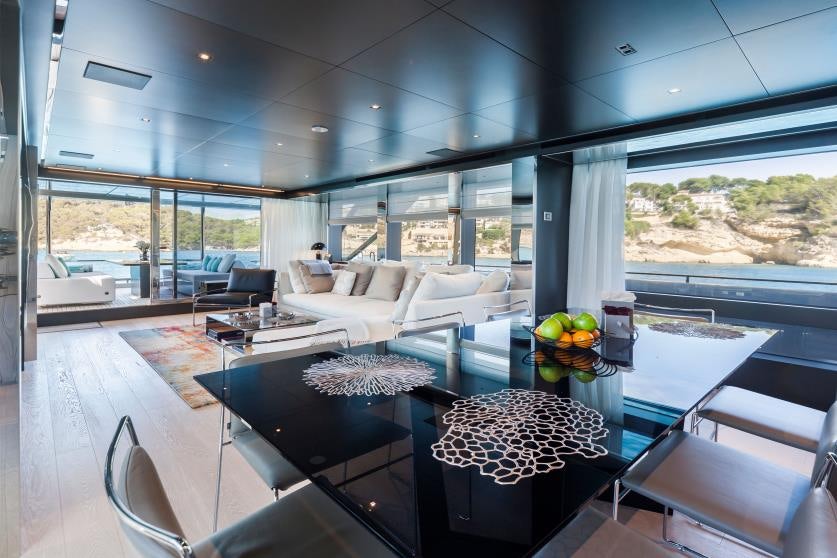 a living room with a large window aboard BARRACUDA III Yacht for Charter